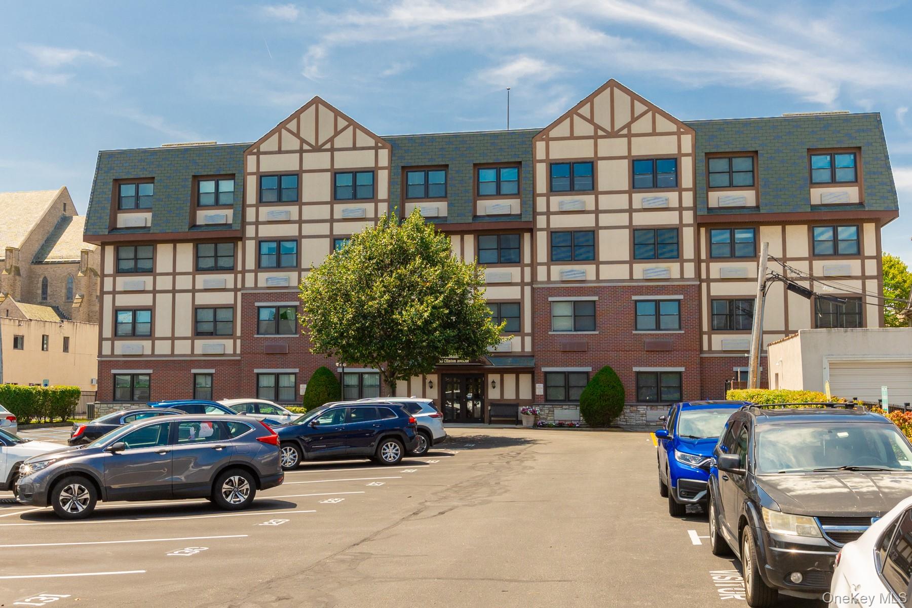 This spacious and inviting fourth-floor condominium is located in the Cathedral Condominiums, a desirable 55+ community in the heart of Rockville Centre. Just a block and a half from the LIRR, across from Saint Agnes Cathedral, and close to shopping and dining, this four-story elevator building offers a prime location. Building amenities include on-site parking with an assigned space, a beautifully designed lobby, a large finished recreation room on the lower level available for private events, and a generous storage locker. Inside, the unit features an entry foyer with a large closet, leading to a well-appointed kitchen with classic wood cabinetry, hardwood flooring, granite countertops, stainless steel appliances, and a center island. The kitchen opens into a bright, spacious living room/dining area, ideal for entertaining or relaxation. A hallway leads to the primary bedroom with a walk-in closet, a second bedroom, a full bathroom with shower/tub and a powder room. The powder room also provides access to a laundry room with extra storage. Very low taxes. Assigned parking spot. Each unit includes an 8' x 10' storage area in the basement. Residents enjoy a spacious community room for parties & special occasions.  Owner pays RVC electric. This apartment provides all the elements for a comfortable and convenient easy-care lifestyle. Min Age 55