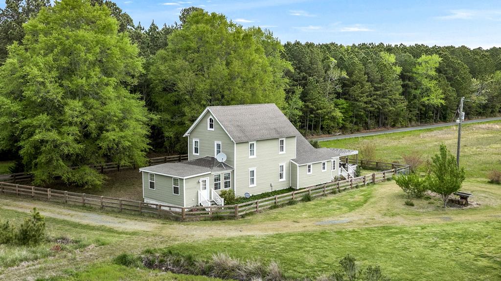 ACCEPTING BACK UP OFFERS! Welcome to a warm and welcoming waterfront 3-bed, 3-bath farmhouse on 12+ scenic acres—perfect for anyone looking for space, comfort, and a slower pace of life. The heart of the house includes a cozy breakfast room, a dining room for family meals or holidays, and spacious living areas filled with natural light. The first-floor primary suite is a true retreat, with its own sitting area—perfect for quiet mornings with coffee or a good book. Upstairs, you'll find two more comfortable bedrooms and a full bath, offering plenty of room for kids, guests, or a home office. Outside, a fenced in yard, rustic barns, and garden space make it easy to jump into hobby farming or keep a few animals. The waterfront adds even more to love!
