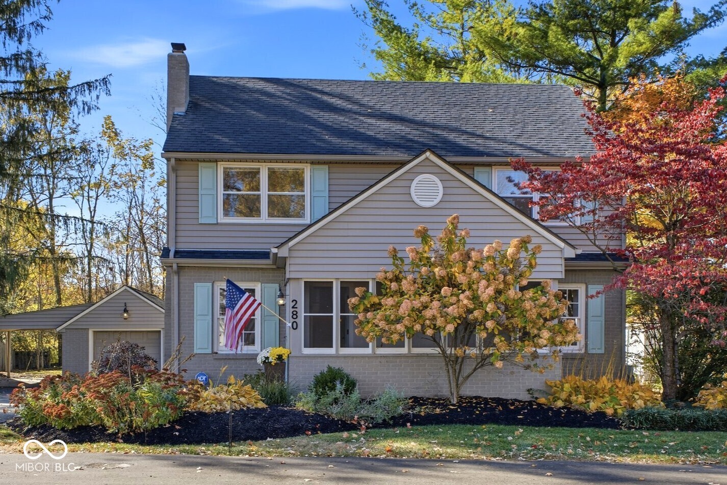 A Timeless Village Treasure Backing to the Rail Trail. Tucked away on a quiet street in the heart of the Village of Zionsville, this 1945 gem offers the perfect blend of small-town charm and everyday convenience. With .31 acres of tree-lined privacy and the Zionsville Rail Trail just beyond your backyard, this home invites you to slow down, breathe deep, and enjoy life at a more peaceful pace on your screened in porch. Inside, history and heart meet at every turn. The main level features original hardwood floors that tell stories of generations past, while solid wood doors and vintage crystal hardware showcase craftsmanship you can feel. As well, the main-level bath, includes the original tub and classic tile flooring, feels like stepping back in time  - in the best possible way.  Offering over 2,200 square feet of finished living space (and more than 2,500 total), there's room to spread out, gather with loved ones, or find a quiet nook for yourself. Each space feels grounded in character yet ready for your personal touch. Notice the brand new professional paint throughout the home along with new carpet in the Rec/Playroom in the Basement, remodeled upstairs bath and new Kitchen Faucet and Lighting in the Dining Room. Step outside and hit the Rail Trail or go a few blocks to the "Bricks" Main Street in the Village - grab coffee at your favorite cafe, stroll through boutiques, or enjoy dinner downtown - all just minutes from your front door.  This is more than a house. It's a piece of Zionsville's story, waiting for you to write the next chapter of your own!