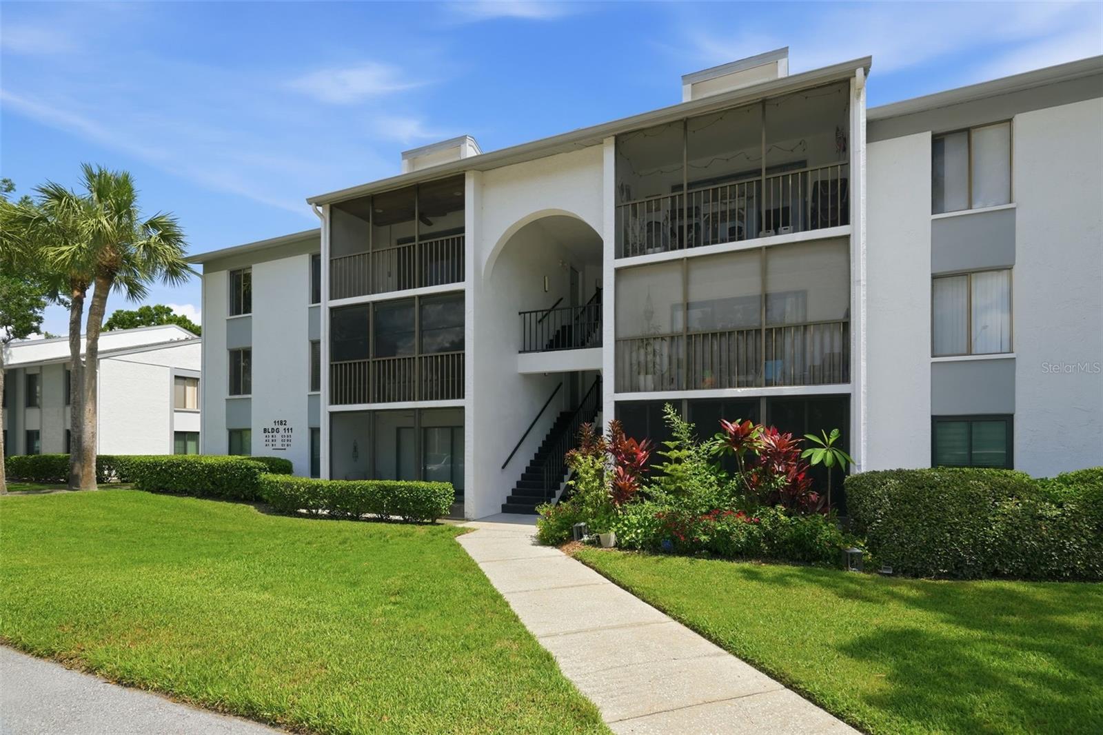 Welcome to Pine Ridge at Lake Tarpon! This clean and well-maintained THIRD-FLOOR condo offers comfortable Florida living in a peaceful community surrounded by mature landscaping and scenic lakes. Inside, you’ll find easy-care TILE and LUXURY VINYL flooring throughout, a spacious living and dining area, and a functional kitchen conveniently positioned just off the main living space. The open living area extends to a Cypress COVERED AND SCREENED PATIO, providing the perfect spot to enjoy your morning coffee, unwind at the end of the day, or simply enjoy the Florida weather.Pine Ridge at Lake Tarpon offers a variety of community amenities, including a sparkling COMMUNITY POOL, TENNIS COURTS, CLUBHOUSE, WALKING TRAILS and peaceful outdoor spaces. The condo fee includes WATER, SEWER, TRASH, INTERNET through Spectrum, and exterior maintenance, helping make everyday living simple and convenient. Reserved parking plus additional guest parking is available. Conveniently located near shopping, dining, recreation, and major roadways, this condo offers an excellent opportunity to enjoy the Tarpon Springs and East Lake area. Schedule your private showing today!
