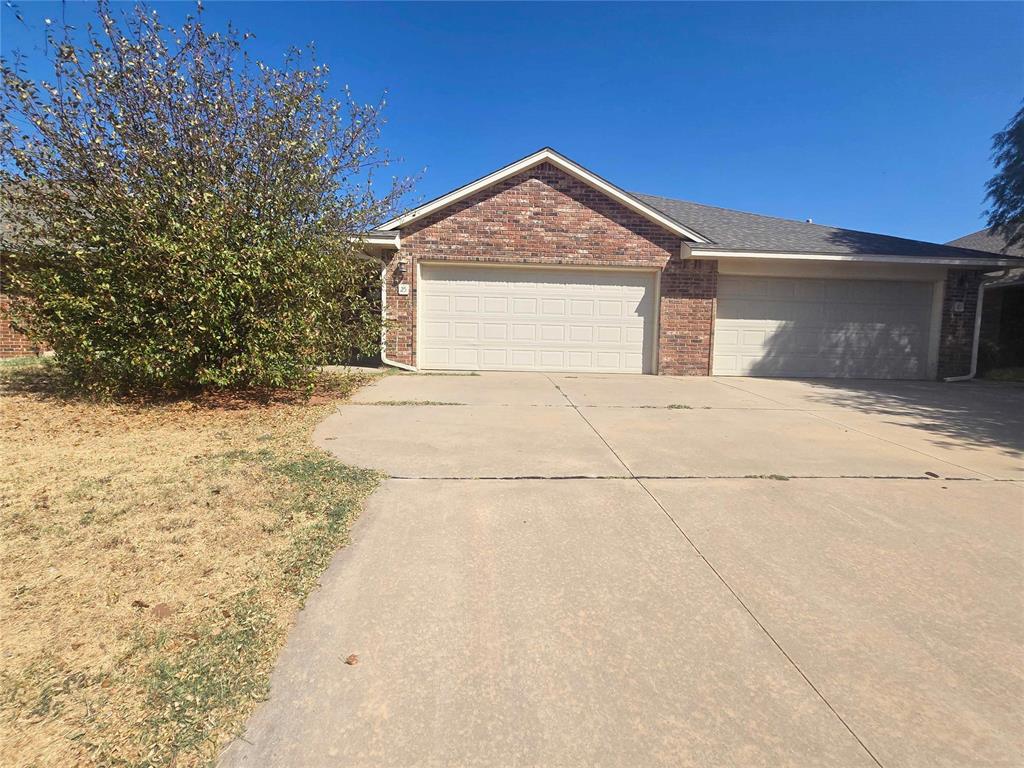 Spacious three bedroom duplex in a convenient Edmond location! This home offers an open floor plan with high ceilings and a large living room that connects easily to the kitchen and dining area. The kitchen provides plenty of cabinet space, all appliances, and bar seating for additional dining. The primary suite includes a private bathroom and access to the backyard. The additional bedrooms offer plenty of space, and the bedroom off the living room could easily be used as a home office or study. Outside, you'll find a manageable backyard that is easy to maintain. A two-car garage provides additional parking and storage. Schedule your private showing today!