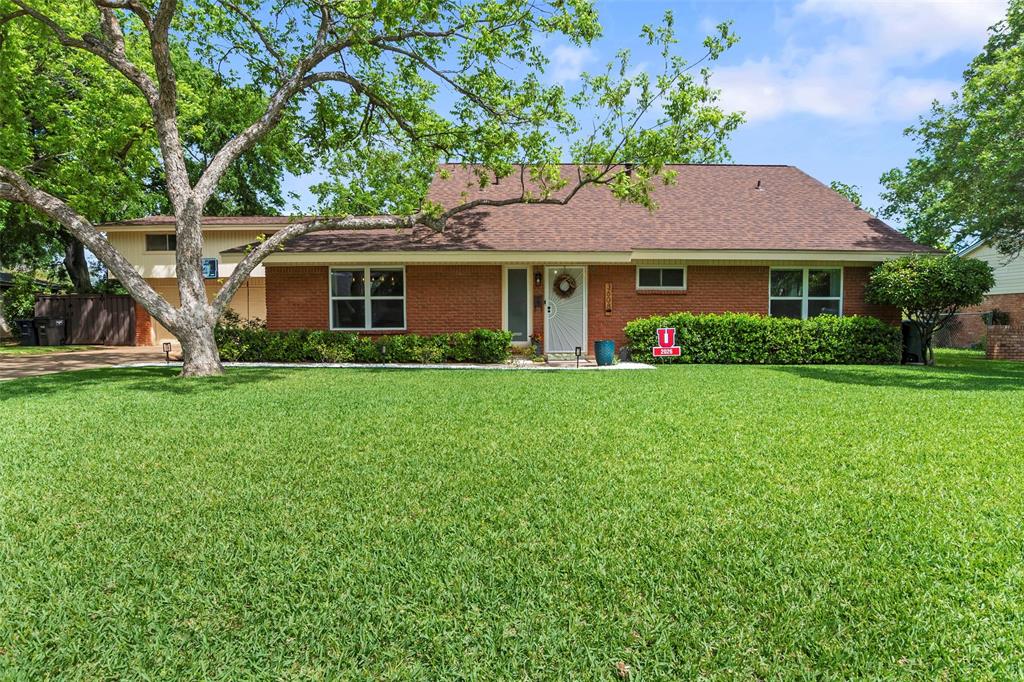 This stunning fully remodeled 1959 mid-century home delivers a rare blend of classic character and modern sophistication, featuring brand-new windows throughout that enhance efficiency and fill the home with natural light. Every detail has been thoughtfully updated, including abundant built-in and custom storage, a beautifully redesigned kitchen with new appliances, quartz countertops, upgraded lighting, and new cabinetry throughout. Freshly installed LVP flooring and tile create a seamless flow, leading to an expanded primary suite with a spacious sitting area perfect for unwinding. All bathrooms have been fully remodeled with modern finishes and updated lighting. Newly exposed stairs with a custom railing dramatically open the living space, while the revamped pantry-laundry room includes a spiral staircase leading to a large den offering exceptional flexibility for entertaining or a private guest retreat. The refreshed sunroom showcases fresh paint and wood beams, and the outdoor living center features a newly installed fireplace, expansive yard, side storage, a dedicated astroturf area ideal for workouts or training, a well-preserved rear shop, and fencing replaced in 2024 with composite wood paneling backed by a 25-year warranty.