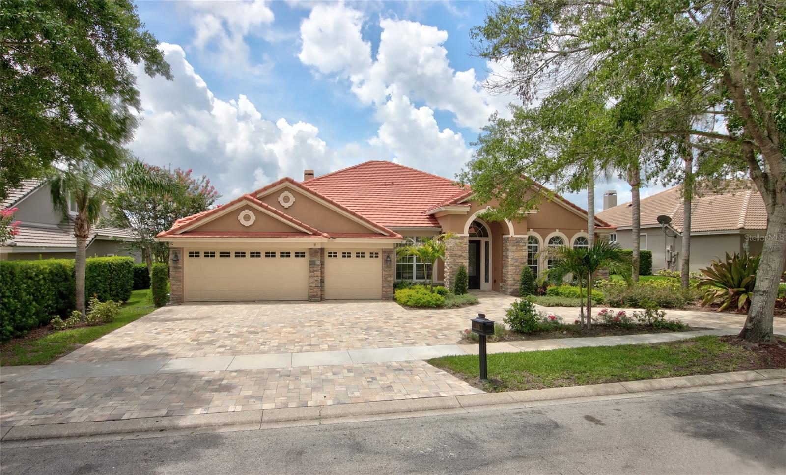 Welcome to this beautifully updated waterfront home in the desirable Kentford Garden neighborhood of Heathrow. Built by David Weekley Homes, this spacious 5-bedroom, 4-bathroom home offers over 3,900 square feet of comfortable living space. Located in the sought-after Heathrow golf community, you’ll enjoy easy access to I-4, 417, and 429, making travel around town a breeze. The home has been carefully maintained and offers a smart, flexible layout. All bedrooms are located on the first floor for convenience, while upstairs you’ll find a large bonus room with a full bath—perfect for a playroom, guest space, or home theater. There’s also a private office for working from home. The renovated kitchen is a true standout, featuring high-end appliances, quartz countertops, and a stylish tile backsplash. It opens up to the cozy family room, complete with a wood-burning fireplace—great for entertaining or relaxing with family. The spacious master suite includes tray ceilings, a separate sitting area, and a fully remodeled bathroom with double vanities, a large walk-in shower, garden tub, and a huge custom closet. Outside, enjoy year-round outdoor living in the large covered and screened lanai, which overlooks a heated pool and peaceful water views. The home also features a brand-new paver driveway with a roundabout for extra parking, wood flooring throughout the main living areas, updated guest baths, a whole-house water purification system, and a fully fenced backyard. As part of the Heathrow community, you'll also have access to 24/7 gated security, Sawyer Lake Park with its playground and sports courts, and a clubhouse perfect for events. This is the kind of home that has it all—space, comfort, and a great location. Come see it for yourself—schedule your private showing today!