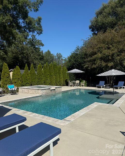 Welcome to this stunning four-bedroom home offering the perfect blend of elegance, comfort, and exceptional outdoor living in desirable South Charlotte! The thoughtfully designed floor plan features a private main-level office, formal dining room, and an impressive two-story great room filled with natural light. The open-concept kitchen, complete with a center island, seamlessly connects to the main living spaces, making it ideal for everyday living and entertaining. Upstairs, enjoy a spacious bonus area offering endless possibilities for a media room, playroom, or additional living space.Step outside to your own private retreat featuring a beautiful modern pool, relaxing hot tub, and fire pit—perfect for entertaining or unwinding at the end of the day. The screened porch extends the living space outdoors, while the fenced backyard and professional landscaping create a peaceful setting with exceptional privacy. A convenient side-load garage adds to the home’s attractive curb appeal.Located in a sought-after South Charlotte area with desirable schools and low HOA dues, this home offers an exceptional combination of lifestyle, location, and value. Enjoy the best of indoor-outdoor living in a home designed to impress!