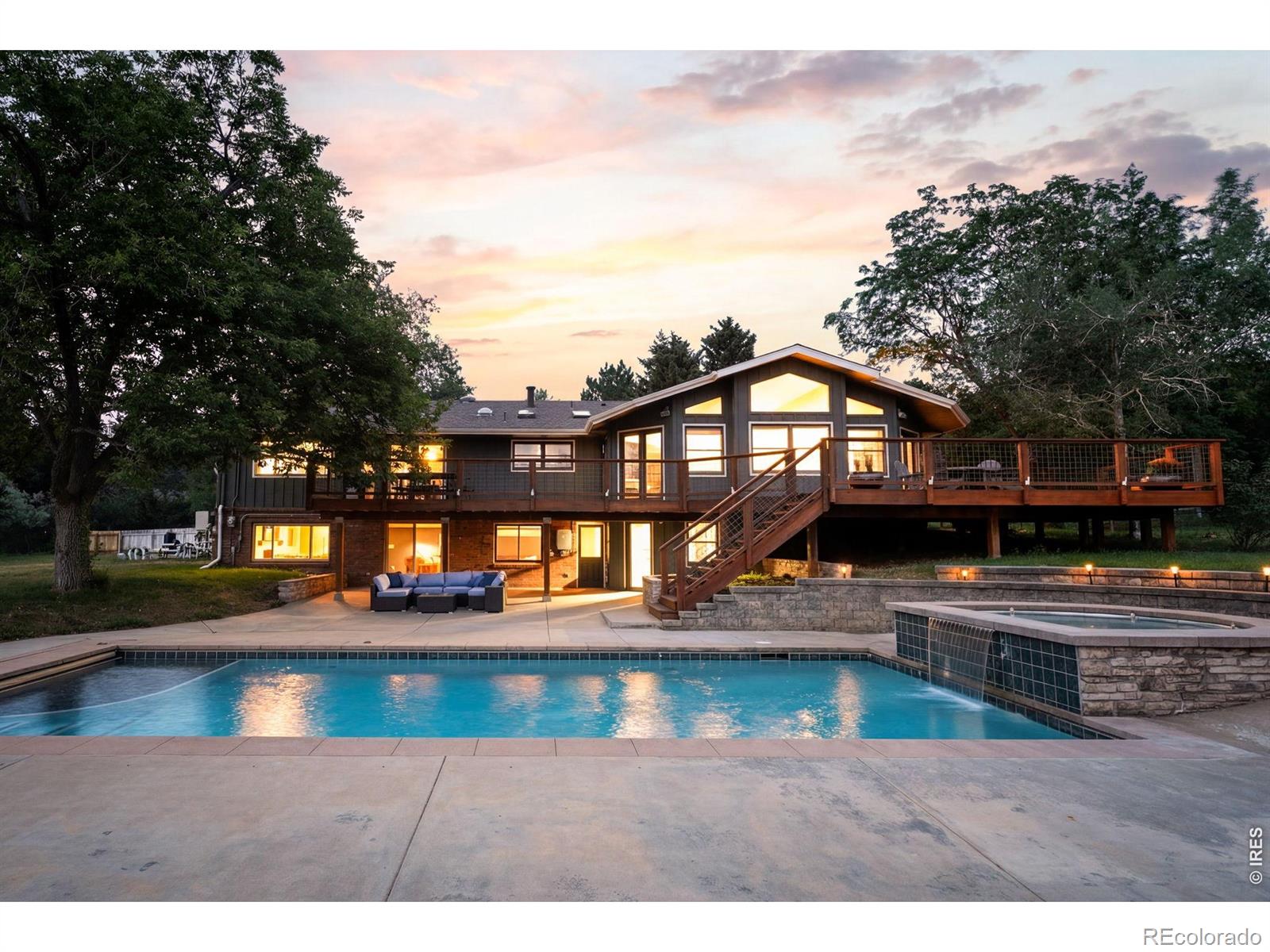 Set on 2 quiet acres with sweeping mountain views, this private 4-bed/3-bath retreat delivers the rare combination of refined indoor living and unforgettable outdoor space. The setting feels peaceful and tucked away, yet the home is designed for gathering, relaxing, and taking full advantage of its natural surroundings. A newly stained spacious deck connects effortlessly to a lower-level walk-out patio, where a glistening pool and hot tub create the perfect place to spend sunny afternoons and enjoy time entertaining friends and family. Inside, the home has been extensively remodeled with a polished, modern feel and thoughtful updates throughout, including new paint and a new mini-split air conditioning system for added comfort. The lower level is open and ready for your personal touch, whether it's a game room or a spacious lounge. The main floor primary suite offers a true escape, with a generously sized bedroom and an expansive spa-inspired bath that blends comfort, function, and style. Outdoor enthusiasts will appreciate the close proximity to walking trails, while the property's elevated views provide a front-row seat to vivid sunsets and dramatic mountain scenery. With its secluded atmosphere, large lot, upgraded interior, impressive entertaining areas, fully paid solar, pool, hot tub, newly stained deck, and remarkable views, this home offers a distinctive opportunity to enjoy private living with comfort, space, and everyday luxury.