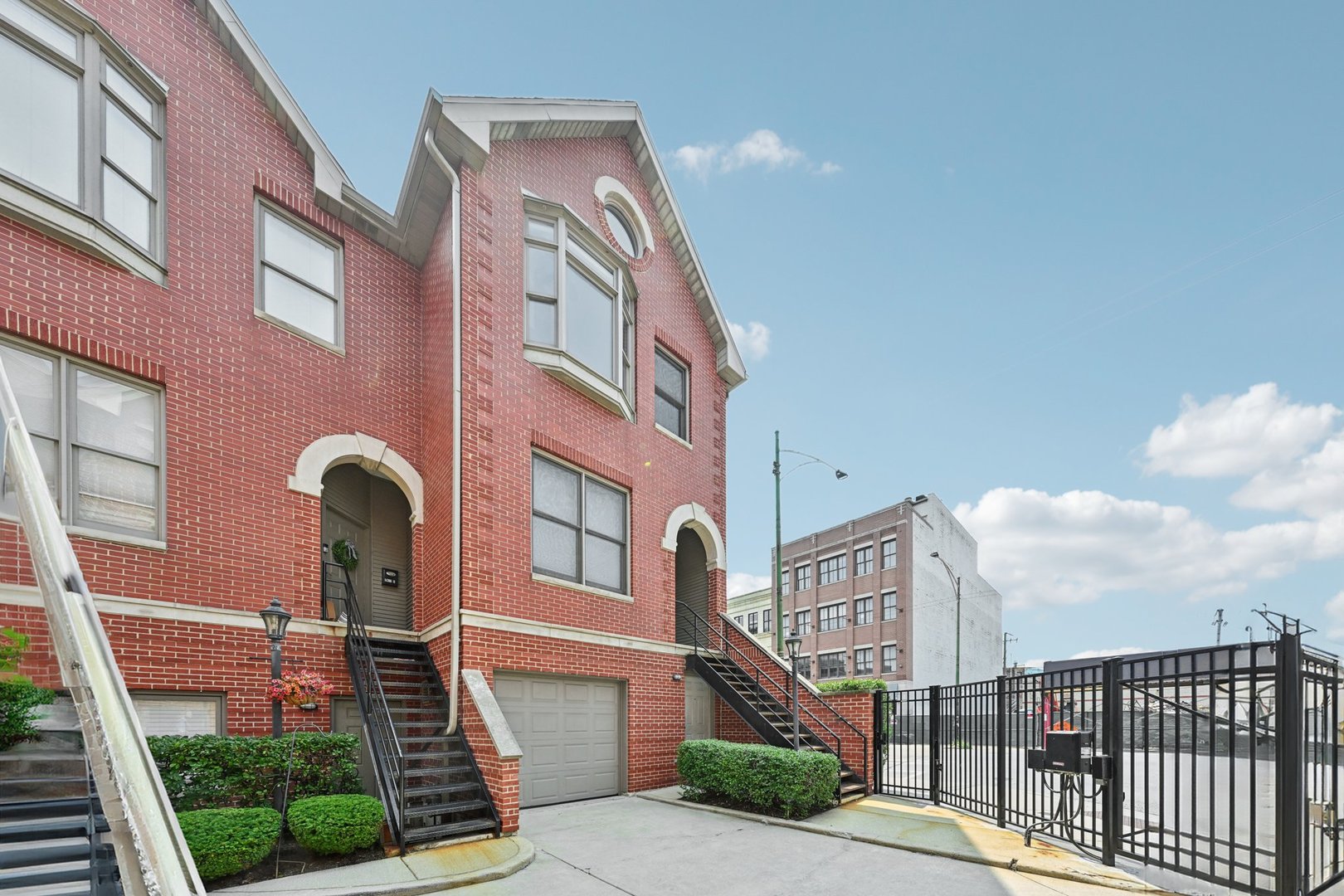 Bright, spacious, and beautifully updated, this end-unit townhome in the heart of Lincoln Park lives like a single-family home.  Tucked inside a secure, gated courtyard, this 3-bedroom, 3-bathroom residence offers 4 levels of thoughtfully designed living space plus a finished basement, 3 private outdoor areas, abundant storage, and an attached heated garage.  The modern chef's kitchen features custom white cabinetry, quartz countertops, a sleek tiled backsplash, stainless steel appliances, and a large island with breakfast bar seating. The dedicated dining area opens directly to a private deck-perfect for grilling and entertaining.  The versatile floor plan includes an entry-level ensuite bedroom with direct access to a walk-out patio and full laundry. Upstairs, you'll find the spacious primary and guest bedrooms, both with ensuite baths. A lofted top-floor flex space-ideal for a home office, nursery, or wet bar-leads to a rooftop deck with stunning skyline views.  Located within the highly sought-after Oscar Mayer School District, this home is just steps from parks, dining, shopping, and all that Lincoln Park has to offer-with easy access to 90/94 and the Clybourn Metra station.