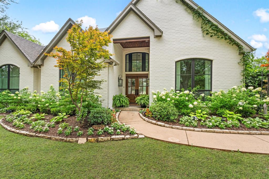 Nestled on nearly 1.5 acres in the heart of prestigious Southlake, this one-of-a-kind property is a rare gem within the coveted Carroll ISD. Featuring four bedrooms, this residence blends upscale living with farmhouse charm. The beautifully remodeled kitchen and bathrooms showcase custom finishes and modern design, while real hardwood floors flow seamlessly throughout the home, adding timeless warmth and character.
Step outside and experience a private oasis: meticulously landscaped grounds, flourishing garden beds and fruit trees, and expansive views of open land that stretch far and beyond. Designed with animal lovers in mind, the property includes horse stalls with dedicated storage, a charming chicken coop, and ample space for livestock or pets.
Saddle up at the barn and enjoy direct access to miles of riding trails at the Corps of Engineers’ Equestrian paths. Located just a short stroll from miles of scenic hiking and biking trails along Lake Grapevine it’s the perfect blend of city convenience and country serenity. Whether you're an equestrian, nature enthusiast, or just seeking a peaceful retreat—this property is a dream come true.