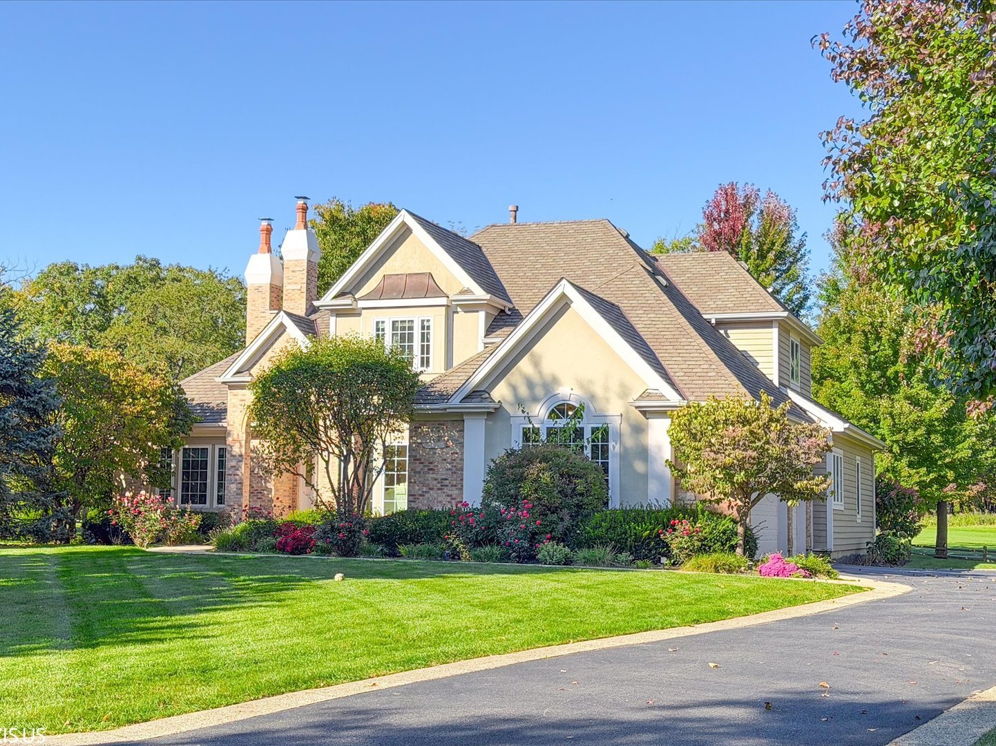 Exceptional value in Aberdare! This beautifully updated home offers breathtaking golf course and pond views, impressive curb appeal, and a prime location near schools, parks, shopping, dining, and recreation. Priced below market for a limited opportunity to own this exceptional property at an attractive value. Soaring ceilings and hardwood floors throughout create a warm, sophisticated feel. The open great room features expansive windows and a new 2 sides fireplace, while the updated all-grey 42" kitchen cabinets, quartz countertops, stainless-steel appliances, and a large island. The first-floor primary suite features a luxurious updated bath with freestanding tub, deluxe shower, and dual vanity. Three spacious upstairs bedrooms include a Jack & Jill bath and a private ensuite. Enjoy spectacular Bittersweet Golf Course views from the maintenance-free Trex deck.  Additional highlights include Anderson windows, cedar and brick construction, and a three-car side-load garage. A rare combination of luxury, views, updates, and value. New professional photos will be added after the sellers' complete preparations for the sale.
