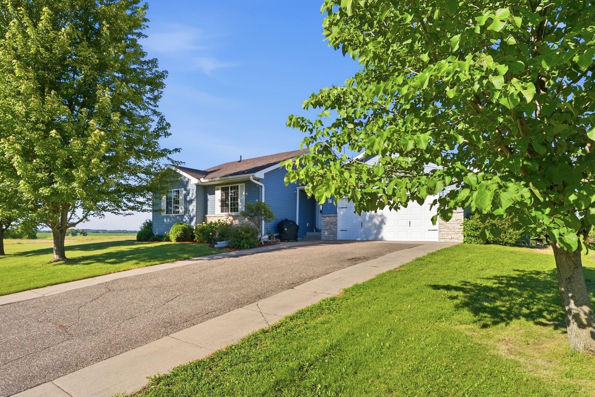 $10,000 PRICE IMPROVEMENT! Welcome to 121 Shire Rd N! Located in a nice, newer Watkins development, this well-kept -bedroom + office, 2-bath home offers nearly 2,000 finished SQ ft with plenty of room to spread out. You'll love the huge entry closet and abundance  of storage throughout, plus a heated and insulated 2-car garage. Outside enjoy the spacious new deck and new roof, both added in 2025-- perfect for entertaining or simply relaxing at home. Inside, the comfortable, functional layout also features a newer dishwasher and water heater. With great storage, generous living space, recent updates and a quiet neighborhood setting, this home is ready for its next owners!