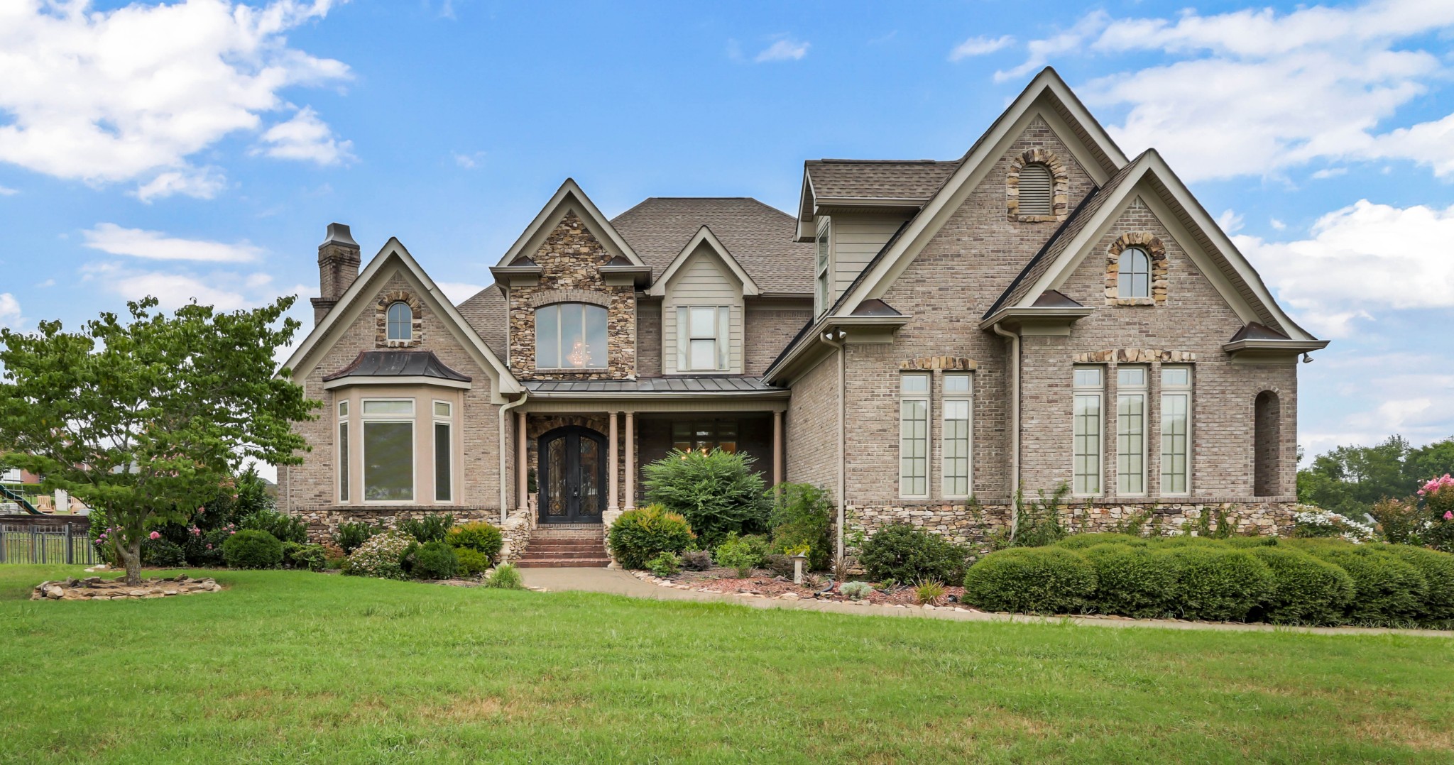 Grand Opportunity in Savannah Lakes – Over 7,400 SqFt of Potential with a view! Welcome to this stately all-brick estate in the desirable Savannah Lakes neighborhood. Set on a spacious lot, this home offers over 7,400 square feet of living space, 5 bedrooms, 5 full baths, 2 half baths, 5 fireplaces, and endless opportunity to make it your own. Sold AS-IS, this home has incredible bones, timeless architectural detail, and beautiful custom built-ins throughout. The main level features a formal dining room, formal living room, kitchen with Butler's pantry and eat-in nook, office, keeping room, powder room, and a large primary suite with sitting area, jetted tub, walk-in shower, dual vanities, and a massive walk-in closet with laundry hookups. Upstairs boasts 3 spacious bedrooms, each with its own attached bath, plus a bonus room. The lower level includes a second primary suite, gym/flex room, second living room, kitchenette, craft room, powder room, and a stunning 750-bottle wine cellar. Whether you’re ready to restore its original grandeur or reimagine it with modern flair, this is a rare chance to own a luxury home in one of Clarksville’s most coveted neighborhoods.Now that you’re picturing yourself in the home, you’ll be happy to know the neighborhood is just as special—with lush landscaping, walking paths, fishing ponds, and underground utilities!