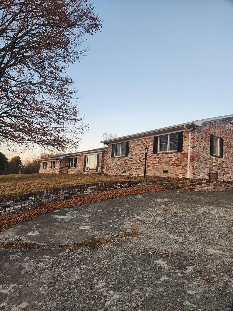 You've been waiting for it, and HERE IT IS!  3113 square foot home with a huge outdoor marble patio that has 4121 square feet for your outdoor pleasure.  Another coveted space is a detached two car garage with additional work space. This icon on the hill at Claypool Hill Virginia, located above Auto Zone, and the traffic light at Claypool Hill, is ready for its new owner in many years.  This home has great view, great space and a huge great room that has it's own fireplace,  stone water fountain, grilling area,  wall entertainment system, full bar space with it's own sink, water fountain, many cabinets and drink storage.  There's spacious buile in gun cabinets and space for cues and balls.  If you're looking for space to have a pool table, there is plenty of space here! This room would also make a perfect theatre room, or whatever you want it to be.  Great views and easy access.  This listing includes two parcels totaling .49 acres.  Other surrounding parcels may be purchased as available if you want more land.  Just buy it all like it is now and you have more space between you and any neighbor.  This house has unique space that you will enjoy!  You've got to come and check out this house for yourself!  Get Moving!