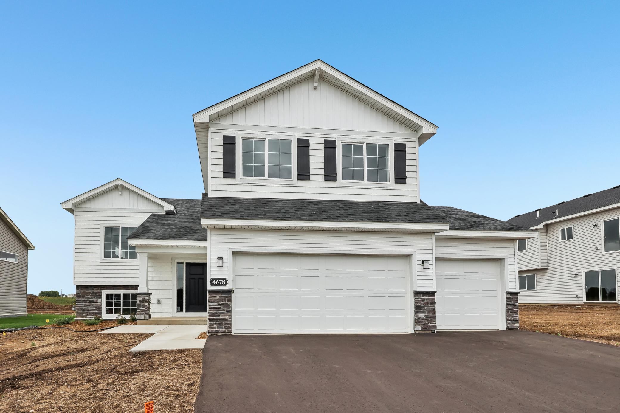 A great home brings everyone together, but an exceptional one gives everyone room to breathe. Welcome to the Weston by JP Brooks, a move-in ready home designed with distinct living spaces that make busy households feel a little more effortless.Step inside from the welcoming front porch and discover a layout that's anything but ordinary. The main living level opens into a bright, connected kitchen, dining, and gathering space designed for the moments that naturally bring everyone together - from morning coffee at the island to weeknight dinners, celebrations, and evenings spent catching up after a busy day.At the center of it all, the kitchen combines style and everyday functionality with quartz countertops, stainless steel appliances, a large center island, pantry, and a window above the sink that brings natural light into the heart of the home. Two bedrooms, a full bath, and conveniently located laundry complete this level, creating incredible flexibility for kids, guests, a home office, or whatever this season of life requires.Then comes one of the Weston's best features: the owner's suite gets a floor all its own. Upstairs, escape to an oversized private retreat filled with natural light, complete with a walk-in closet and ensuite bath featuring dual sinks. It's separation in all the right ways. A quiet place to begin your morning and unwind at the end of the day.Downstairs, the finished lookout lower level creates an entirely separate living experience with an expansive family room, two additional bedrooms, and a 3/4 bath. Imagine movie nights, game days, a teen hangout, overnight guests, or simply having another space where everyone can spread out and make themselves at home.With five bedrooms, three bathrooms, a finished lower level, and a three-car garage, the Weston delivers the kind of flexibility that's hard to find, all wrapped into a thoughtfully designed 2,263-square-foot floor plan.Located in Monticello's growing Meadowbrook community, you'll enjoy the neighborhood feel of new construction while remaining conveniently connected to parks, schools, shopping, restaurants, and everyday amenities.The Weston isn't about having space simply for the sake of having more. It's about having the right spaces in the right places. Room to gather, room to retreat, and room for life to change along the way. Come experience this move-in ready home and discover just how well the Weston lives.