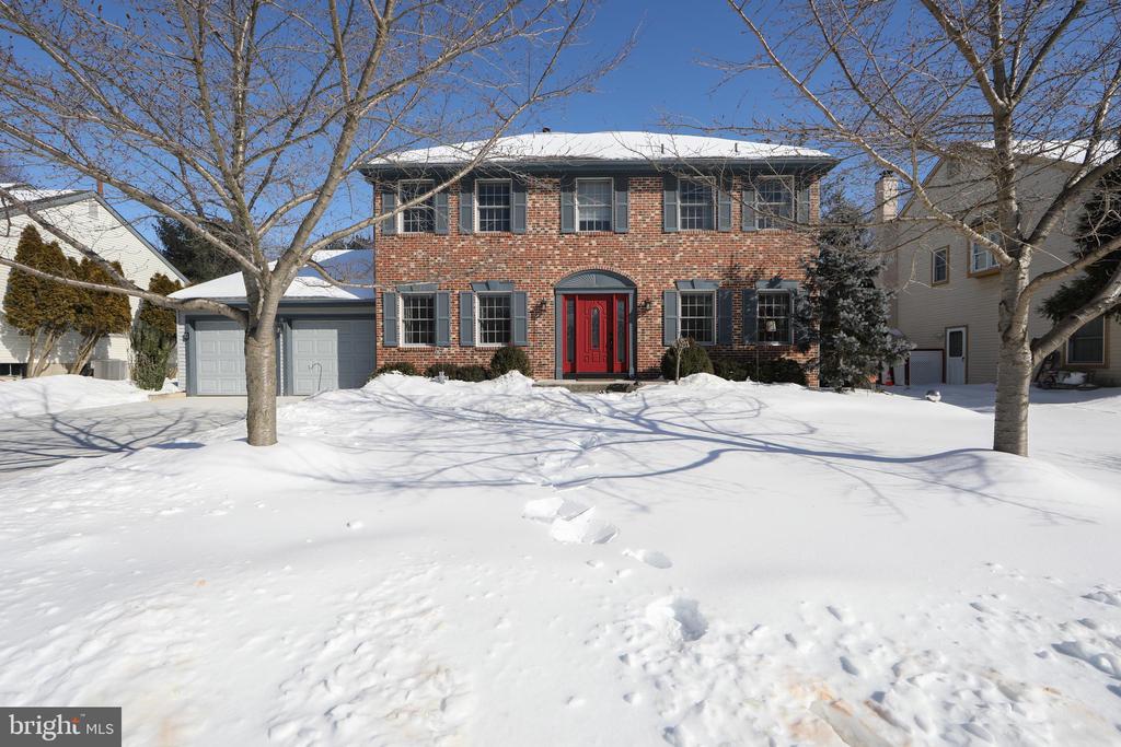 Welcome to this beautiful two story brick colonial. This home has been beautifully updated and lovingly cared for. The center foyer colonial welcomes you with warmth of an open foyer and staircase, formal living room and dining room, wood flooring and soft, fresh paint. The updated kitchen boasts quality wood cabinets, update stainless appliances, granite counter tops, eat-in dining plus an island peninsula open to the cozy recreation room. The recreation room allows for spacious seating and has a cozy fireplace. 2nd floor has 4 spacious bedrooms. The owner's suite is a 3-room suite consisting of large sleeping area, private dressing room with elegant custom update full bath and the third room sitting room has its own fireplace. Down to the finish basement enjoy the extra living space of an additional recreation room, exercise area and custom bar (stools included). For your extra storage there is an unfinished storage and mechanical room. The back yard is spacious boasting a deck off the kitchen with attached sun catching canopy. This home is truly move in and ready for a new owner.