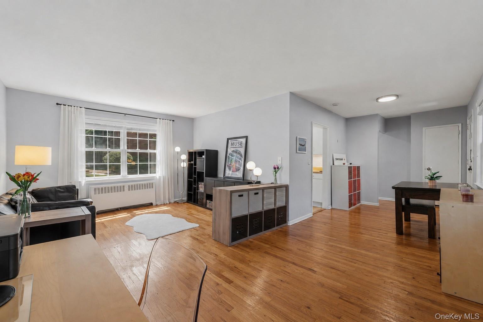 Step Into What’s Next - - At Rex Ridge, one of Hartsdale's most desirable complexes, this move-in ready corner apartment delivers privacy and convenience without the burden of traditional homeownership. With IN-UNIT WASHER AND DRYER (RARE for Co-ops), personal patio space, pool, playground, parking, and modern interiors - it’s everything buyers want, yet rarely find together. Enjoy all the comforts of homeownership while leaving the mowing, shoveling, raking, and pool maintenance to someone else.Move right in and enjoy: all hardwood floors; fresh paint; spacious living room with home office; dedicated dining area; crisp white kitchen; modern bathroom and thoughtful updates throughout. The oversized bedroom offers excellent natural light and generous closet space. Step outside to your own personal patio - perfect for BBQ’s, outdoor dining, morning coffee, evening cocktails and sunsets, just steps from your front door. Additional features include on-site storage units (waitlist), bike storage, on-site management and a live-in super. One indoor cat permitted (no dogs). Subletting permitted (up to 5 years) after occupying for 3 years - providing flexibility for the future. Maintenance Fee includes: property taxes, heat, and hot water, grounds maintenance, snow removal, pool and playground maintenance, and landscaping.  Conveniently located between Hartsdale Village and Downtown White Plains, you'll be moments from restaurants, cafes, fitness centers, shopping, farmers markets, parks, golf courses, Bronx River trails, and Metro-North service to Grand Central (approximately 35 minutes).Amenities and everyday comfort come together to create a one-bedroom that truly stands apart. Come see for yourself - Schedule your private tour today.