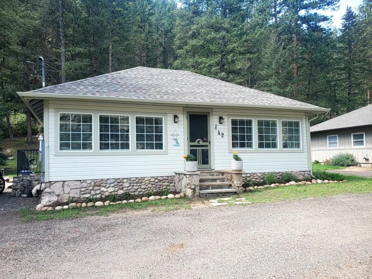 HUGE PRICE ADJJUSTMENT!!!! Great price for a fully updated cabin!! Drop your fishing line out the front door and right into the Big Thompson River! Charming 1920s cabin completely remodeled from the ground up in 2022. New large ceiling beams installed, spray foam insulation added to all walls and ceilings, new wiring and plumbing. Newer windows, new sheetrock, new paint, new refrigerator, oven, and microwave; new shower, toilet and lavatory. New stackable washer and dryer and a two new split unit airconditioner/heaters that keeps the cabin the perfect temperature year-round. All furniture, appliances, pots and pans, plates, utensils, and bedding stay with the cabin. House has been completely permitted and approved with an occupancy permit. Brand new 1500 gallon septic vault. Adirondack chairs included. Roof is 14 years old and new leaf filters added to the gutters so that you don't need to clean out pine needles. This house is ready to move into and there is nothing that needs to be done! Water filtration system, water heater and holding tank all new in 2022. Brand new queen sofa couch so you can easily sleep 4. Add a couple of cots and sleep six! Turnkey - everything included. You must see this one to appreciate it! Year round cabin. Contact Larimer County about short term rental possibilities.