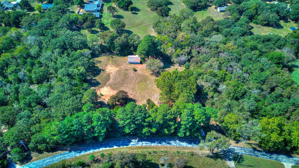 Build your dream home!  The building on the property is 1000 sf.  There is electric at the building and  it has been plumbed for a bathroom and kitchen.  He was never able to complete it.   Very nice lot and close to the lake.

The HOA is for road maintenance.