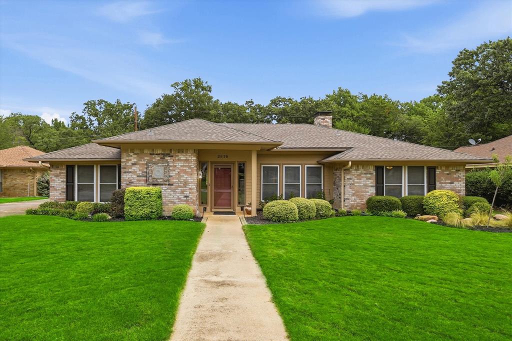 Peaceful & private best describes this sought-after Grapevine single story home with a saltwater pool nestled on a tree-lined creek lot! You’ll love the welcoming curb appeal, impressive wraparound driveway & lush landscaping. The family room features a handsome stone fireplace, wood floors, wet bar & picture frame moldings. The office can double as a guest room, gym or game room with an adjacent half-bath. A tiled Florida Room is illuminated by skylights & has a sliding glass door to the patio & pool. Kitchen is equipped with a gas range, s-steel appliances, granite counters & travertine backsplash. Primary suite offers patio access, a jetted tub, frameless glass shower, granite vanity & WIC with Elfa shelving. Step outside to discover a backyard built for relaxation, parties & play. Enjoy summer evenings by the pool watching fireflies dance across the sky. Updates & energy-efficient features include: new Roof & upgraded insulation (2025), Nest 2 Zone thermostat (2025), energy efficient pool pump (2026), Level 2 EV garage charging port (2026), new garage door opener (2026), vinyl clad replacement windows, recent water heater & HVAC. A giant storage shed provides practical space for tools and equipment. Location truly sets this property apart. Just a short walk to Parr Park offers something for everyone with playgrounds, walking & running trails, a spray-ground, pavilion & baseball fields. Students will love the ability to walk to highly regarded GCISD schools, while commuters will appreciate the central location between Dallas & Fort Worth with quick access to DFW Airport. Shopping, dining & entertainment are all nearby, giving you the best of convenience and community. If you love celebrating the holidays, there’s no better place to call home than Grapevine, famously known as the Christmas Capital of Texas, with year-round charm & community events that make every season special. Owners might consider selling the house fully furnished so inquire with listing agent.