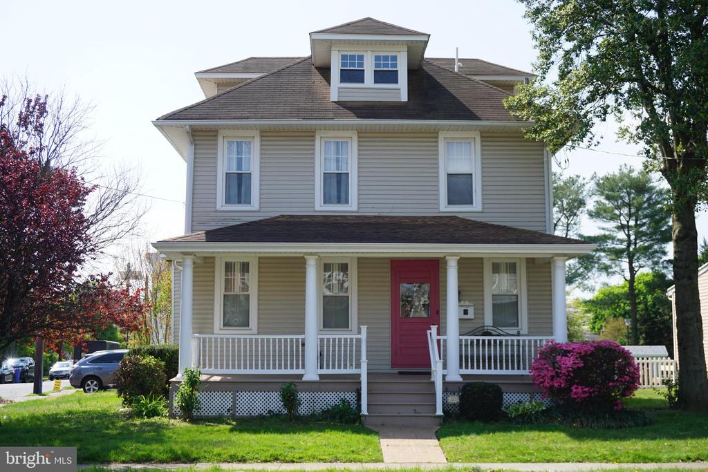 Step into a home where timeless character meets modern comfort, nestled in a beautiful and historic neighborhood. From the moment you arrive, the stamped concrete walkway guides you to a welcoming front porch with low-maintenance Trex decking—perfect for relaxing and enjoying the surroundings.   Inside, you’re greeted by high ceilings, gleaming original hardwood floors, and elegant details like 6-inch trim and crown molding that add warmth and sophistication throughout. The spacious living and dining rooms flow seamlessly, leading into a generous family room designed for gathering and entertaining.  The kitchen is both charming and functional, featuring upgraded appliances and a unique butler’s pantry—large enough to double as a cozy morning room or office—along with an additional hallway pantry for extra storage.  Out back, you’ll find a beautifully landscaped yard with a large Trex deck and a lovely pergola, creating an ideal outdoor retreat. A stamped concrete patio and rare off-street parking with a two-car driveway add even more convenience.  Upstairs, the second floor offers three generously sized bedrooms and a stylishly updated full bathroom, complemented by a first-floor half bath. Additional attic storage ensures plenty of space for your needs.  Do you need a 4th Bedroom - there is room for that to be finished as well.   Meticulously maintained and in pristine condition, this home truly shines. Located just half a block from Kennedy Park and the local middle school, it offers both charm and convenience in an unbeatable location.  Come experience it for yourself—this one is truly special.