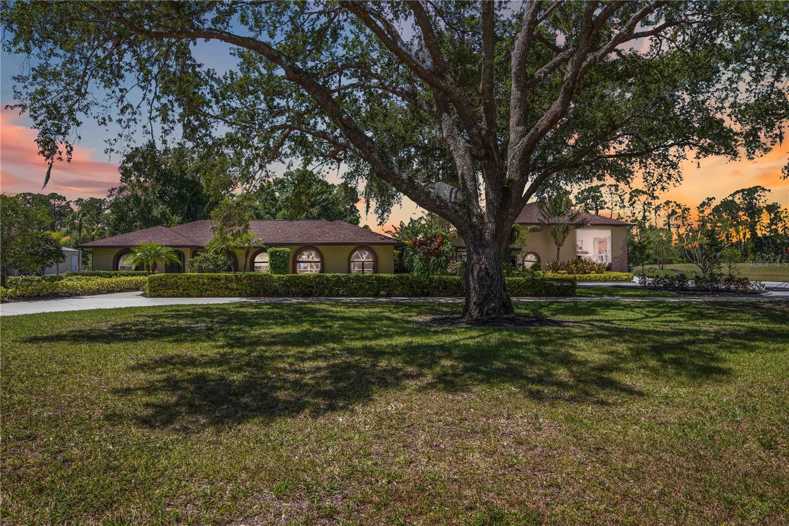 $250,000 Price Improvement! Rare Lakefront Estate on 3 Acres — Plus 3 More Acres Available Separately!

This is your chance to own one of North Port’s most private and versatile estates — now listed at $1,249,990, a $250K price improvement from its original $1,499,990! Offered on 3 serene lakefront acres, this property is tucked behind a Wi-Fi controlled gated entry and custom roadside black cross-fencing, as well as surrounded by mature picturesque oak trees, delivering the ultimate in space and tranquility.

Here’s what makes this property even more rare: an additional 3 cleared, buildable acres (with its  own deed) is available separately, right next door — giving you the opportunity to expand with a guest house, barn, or future family compound. Georgia clay fill dirt is already on-site and ready to go! Take advantage of this flexibility while it’s still available.

The main home offers over 2,600 sq ft of updated living space, featuring 3 bedrooms, 2 full bathrooms, rich Chicago brick accents, granite countertops, plantation shutters, and warm, timeless finishes. Step outside to a resort-style pool with rock waterfalls, a water slide, and a large patio space perfect for entertaining or relaxing under the Florida sun.

Enjoy direct access to a 21-acre spring-fed lake with your very own Trex-built dock — perfect for kayaking, fishing, or soaking in the view.  Watching the Bald Eagles dive for dinner, or the occasional flock of docks doing a fly-by as the sun sets never gets old!

And for hobbyists, business owners, or creatives — there’s a 2,400 sq ft two-story block & stucco constructed workshop with 375 sq ft of air-conditioned living/office space with its own bathroom, plus an additional 375 sq ft of finished space upstairs — ideal for hands-on work, storage, a private studio or convert into an extra bedroom!

Opportunities like this don’t come around often — especially not with this much land, flexibility, and lifestyle, all in one package.  Schedule your tour today before it’s gone!