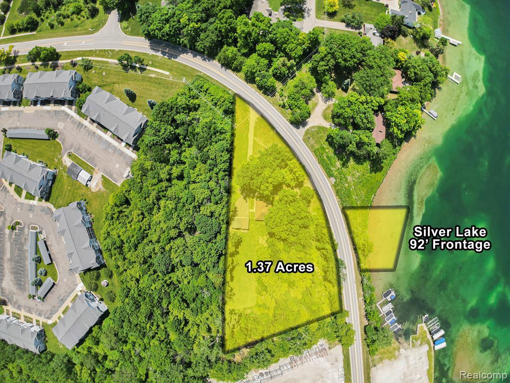 92 feet of frontage and 1.37 acres on all-sports Silver Lake! This property features prime lake frontage directly across the road, offering scenic views and access to one of the area's most desirable lakes. The well-maintained 2-bedroom home and detached garage sit on a generous lot with flexible zoning, allowing for residential or commercial use—perfect for investors, developers, or those looking to enjoy lake life with added potential. Ideally located between an established marina and an apartment complex, this property presents a rare chance to own a versatile piece of lake-adjacent real estate with endless possibilities.