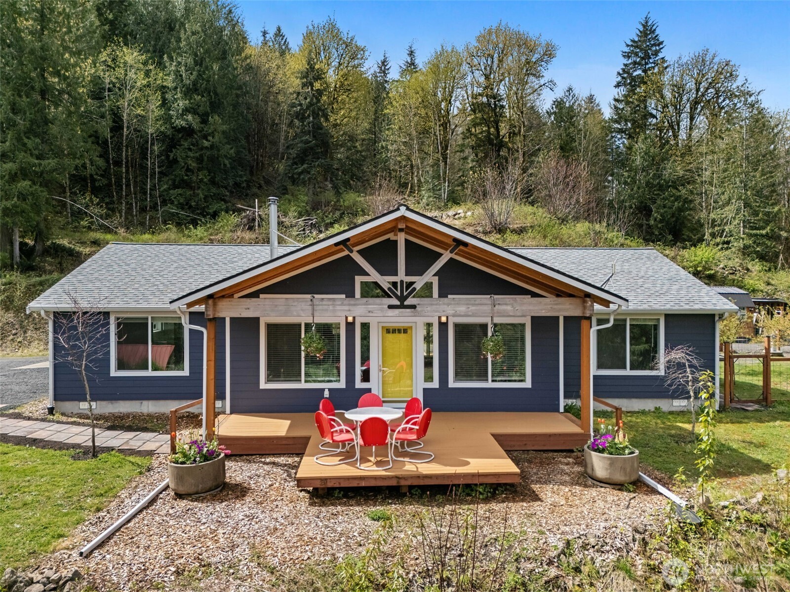 Country living at its finest! 2020 custom home on 28+ acre homestead, private forest, park like setting & sweeping Mtn views! The home features vaulted ceilings, lots of natural light, AC, tankless water heater, covered porch & deck, covered patio with fenced yard, and inviting outdoor spaces. Open concept kitchen, dining and living room. Kitchen features a large island, stainless appliances, lots of storage and counter space, dining that opens to covered patio, fenced with fruit trees and gathering area. Living room features lots of windows and woodstove. Large primary suite features large windows, walk-in closet & primary bath with walk-in shower. 2 additional bedrooms and full bath, laundry room with newer washer/dryer, folding table. Functional 1780SF living space, attached 2 car garage with parking area. 24x48 Pole building with full RV hookup & permitted to finish as a shop, additional RV hookups, 12x40 Machine shed, newer 10x20 Old Hickory Shed, finished & insulated with AC/Heat, 2 lofts, fenced garden area with raised beds and garden shed with power & water, a greenhouse with shelves and commercial fan, slide doors with screens, covered wood storage, well house. Circular driveway. Own your own forest and spring, abundance of nature. Walk to the Tilton River, multi-generational potential, and sustainable living. Move-in ready private retreat with modern comforts, sustainable features and endless room to grow and homestead!