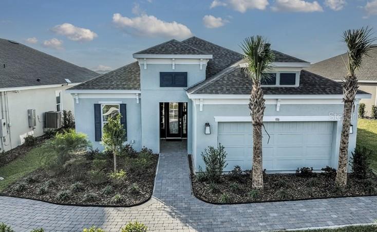 What's Special: Model Home | Water View | Premium Location | Flex Room | Covered Patio | Extended Patio. New Construction - April Completion ! Built by Taylor Morrison, America's Most Trusted Home Builder. Welcome to the Lazio at 936 Arbor Green Trail in Esplanade at Center Lake Ranch! Just off the foyer, you’ll find a welcoming secondary bedroom, full bathroom, and flex room, while the opposite side offers another secondary bedroom with its own private en-suite bath, plus the laundry room and garage entry. At the heart of the home, the dining room opens into a bright, spacious great room that feels warm and inviting. The designer gourmet kitchen features quartz countertops, a large island and overlooks the great room, creating an effortless flow out to the lanai and private pool where you can relax and recharge. The primary suite sits quietly at the back of the home with a lovely bay window, a soothing en-suite bath, and a generous walk-in closet. This thoughtful layout gives you comfort, versatility, and a beautiful space to enjoy each day. Additional Highlights Include: Gourmet kitchen, bay window at primary suite, extended covered lanai, private pool, 10' ceilings, tray ceiling at great room and primary suite, 8' interior doors, 4' garage extension, GE refrigerator, and washer and dryer. MLS#O6382286 Experience resort-style living in St. Cloud, Florida, at Esplanade within the gated Center Lake Ranch community. With homes offering stunning nature and pond views, every detail is designed for peace and relaxation. Enjoy wellness-focused amenities like a pool, spa, fitness center, and movement studio. Stay active with pickleball, bocce, or strolls through the Bark Park, while concierge services and community events keep life exciting. With planned trails, parks, and an 11-acre Central Park, Esplanade offers a serene, nature-filled lifestyle with easy access to major roads.