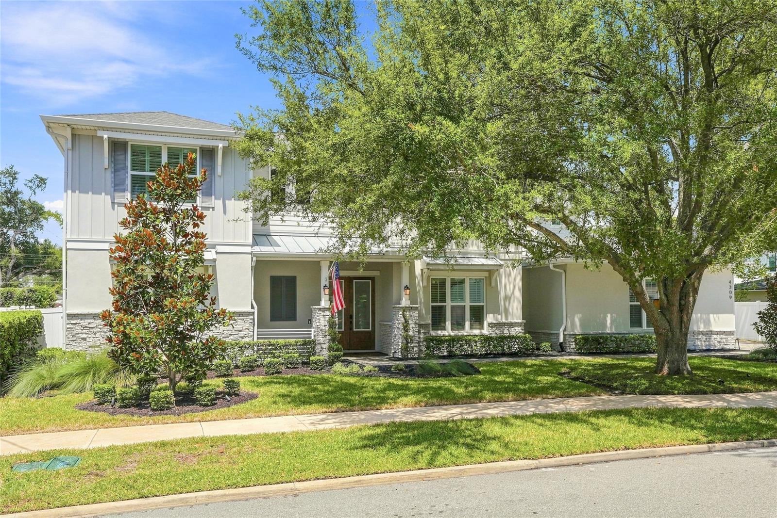 This meticulously maintained 2021 New Legacy Home offers 5 bedrooms, 5½ baths, a recreation room, a media room, and features you simply won’t find in many newer homes at this price point—including a sparkling pool and spa on an enormous 100' x 100' lot. Presenting like new, this exceptional residence offers a peaceful setting with room to relax, entertain, and play. The spacious lanai features a tongue-and-groove ceiling and a fully equipped outdoor kitchen, complete with an unused Big Green Egg. Beyond the pool deck, a generous natural lawn with room to play. Inside, carefree wood-look ceramic plank flooring flows throughout most of the home. The thoughtfully designed floor plan includes a main-level primary suite and a guest suite with its own exterior entry to the backyard. The open-concept living area is ideal for gatherings, with a sunny breakfast area adjoining the gourmet, chef-inspired kitchen. The impressive center island creates a natural hub for conversation and entertainment. The kitchen is exceptionally appointed with a gas cooktop, pot filler, Fisher & Paykel appliance package, double ovens, 24" refrigerator and freezer towers, wine refrigerator, soft-close cabinetry and drawers, and a large walk-in pantry conveniently located beside the mudroom—offering the potential for a future butler's pantry. A well-designed laundry room includes a pet spa and exterior access to the pool deck for added convenience. Upstairs, three additional bedrooms feature walk-in closets, with two offering full ensuite baths. A separate full bath conveniently serves the rec and media spaces. The media room is currently being used as a home gym and features professionally installed gym flooring. A secondary laundry closet with hookups adds another layer of convenience. Additional upgrades and features include Plantation shutters throughout, Impact windows, an Elan home automation system, 18 SEER Infinity Carrier AC with Wi-Fi controls, in-wall pest tubes, 8-foot interior doors, audio pre-wiring, USB outlets, Icynene spray-foam insulation, and approximately 80 square feet of semi-conditioned attic storage. The side-access garage enhances parking flexibility, while the pavered driveway provides ample space for guests when entertaining. Thoughtfully designed and loaded with upgrades, this home truly checks all the boxes.