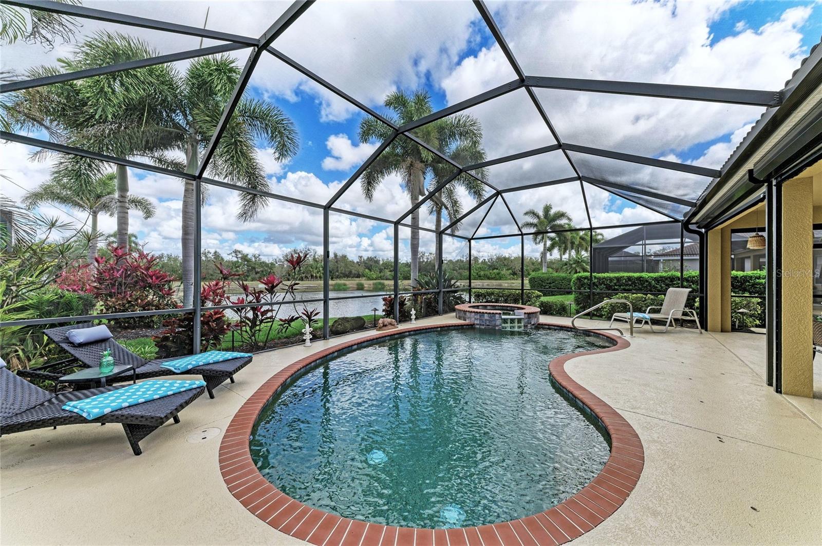 New Price adjustment-check this out! Location, location, location! You’ve heard the golden rule of real estate & that’s just one of the things that make this home so SPECIAL! Located well within the gates of River Strand Golf & Country Club with a stunning water view & a cul-de-sac location, this home is your perfect TROPICAL OASIS.  This home comes with a GOLF-DEEDED Membership which means you only pay cart fees for this lush, well-maintained 27-hole golf course.  The BONITA is a favorite floor plan because it offers an OPEN CONCEPT but the best part is the expansive GREAT ROOM which flows seamlessly out to your lanai through quadruple sliding glass doors.  Imagine the fun you’ll have with your friends and family sitting outside enjoying your favorite beverage while grilling out or taking a dip in your SALTWATER pool and spa-this is the epitome of Florida living. Let’s talk about UPDATES which make this home unique: Starting with the front entry which has been screened, allowing you to leave the door open to feel the beautiful breeze through your home. NO CARPET here, as the bedrooms all have wood-look ceramic tile. Don’t worry about bugs, the owners have re-screened using 20/20 screening & installed a misting system around the pool cage. The Kitchen has GRANITE countertops, and the owners have contracted and paid for KITCHEN CABINETS to be refaced with new doors, facings & hardware which is to be completed in May. Newer HVAC, Water Heater, Washer & Dryer & Pool Pump add up to serious $avings for you.  In the event you need it they installed hurricane rated screens which come down to cover the lanai area.  Outside you’ll see the exterior has been painted, landscape lighting added in back by the pool cage, the lanai has been painted & sealed as well as the driveway and back paver area. I’m serious, they thought of everything and now this lovely home is waiting for you.  River Strand Golf & Country Club is a friendly community with a 27-hole Arthur Hills designed golf course, 9 Har-Tru Tennis Courts, 8 Pickleball courts, 2 Resort-Style Pools, 6 Satellite Pools, currently renovated Clubhouse set to open mid-March with a restaurant & social events, Community Center & 2 fitness centers in this luxury gated community with 24 hr. security & lawn maintenance. Convenient location to I-75, Costco, Target, Hobby Lobby & more, University Town Center, & beaches complete the package. River Strand Golf & Country Club More than a Community, It’s a Lifestyle.