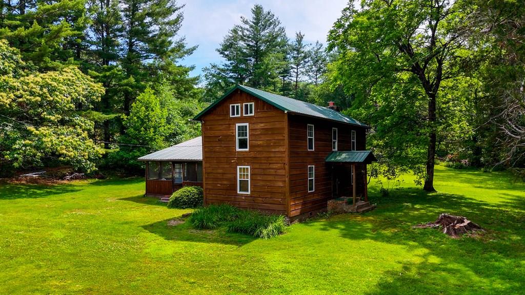 Paradise Found! Located at the end of a state road lies the serenity of Laurel Creek Farm. This pastoral property is situated in a wide valley surrounded by some of the best scenery and wildlife habitat available. Miles and miles of trails exist for the experienced and novice ATV rider. Complementing the property is a spacious and comfortable cabin that was reconstructed around 1900 from two hand-hewn cabins. More recent updates add convenience while retaining the craftsmanship of centuries past. Sun-drenched meadows used for hay dot the property. Cool mountain springs supply water to the home and stocked pond as they gently flow into Laurel Fork Creek, where the owners often fished for native trout. Approximately one half of the timber was cut several years ago; however, the young timber has reestablished, making great habitat for many species of wildlife including grouse, turkey, bear, deer, bobcat, coyote, and more. The owners carefully considered the timber harvesting. Many stands of large, high-quality timber remain untouched. Harvesting facilitated not only the creation of habitat but the making of miles and miles of excellent ATV, walking, and horse trails. There are trails suitable for novice and more experienced riders. One can ride for hours and never see the same place twice. Suitable for a family compound, corporate retreat, or hunting club. Imagine owning a property so private, with unlimited opportunities to explore, hunt, and escape the noise of everyday life. Bounded on the south by Buckhorn Mountain and to the north by East River Mountain, which separates Virginia and West Virginia. Convenient to Bluefield, Wytheville, and Bland. Just minutes from I-77/I-81. Nearby are famous ATV attractions, lakes, and streams. Many enthusiasts will only dream of owning a property of this caliber. Build your legacy here. Make memories with family and friends that last—and are spoken of for years to come.