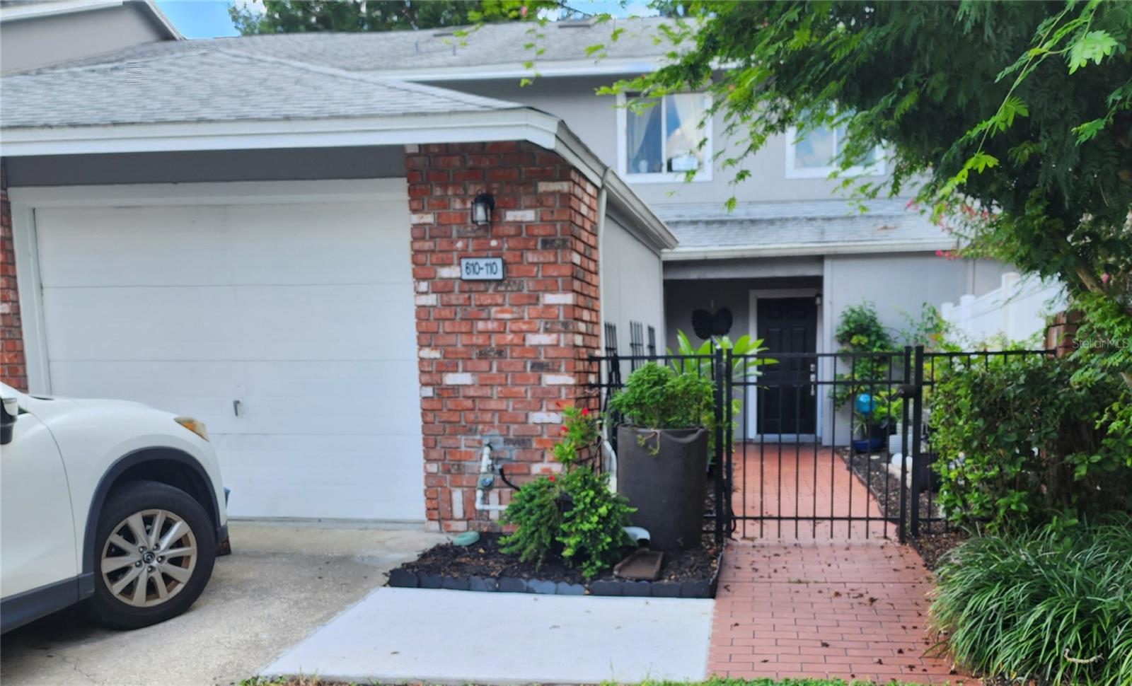 Looking for a updated townhome in a great community and convenient location?  Then this house is for you.  This townhome condo has three bedrooms, 2/5 baths, 1775 square feet, a private gated front courtyard and a screened porch room.  The decorator kitchen has been enlarged to include an island, all lower cabinets have pull-out shelves.  Appliances replaced in 2017 along with two new air conditioners in 2025.  Hard surface floors in all but one bedroom.  All of the bathrooms have been remodeled with a soaking tub in the master bath.  Storage space galore with two closet in the master and a loft that can be use for storage.  A large foyer closet was added during the kitchen remodel.  The building was reroofed and painted in 2022.  Parking in the one car garage and in the driveway.  The association fee of $613 monthly includes internet and cable. Oak Harbour is a beautiful tree-line community on Lake Orienta with boat parking available and a covered dock for fishing or watching the sunset.  There is a large clubhouse with pool tables, a ping pong table, a library and game rooms.  The fitness center, tennis/pickleball, basketball and shuffleboard courts and a second pool rounds out the amenities at Oak Harbour.  Oak Harbour is a pet-friendly community with no breed or weight restrictions.  Conveniently located near Altamonte Mall, Advent Health Hospital, restaurants and all Central Florida attractions. OWNER MOTIVATED