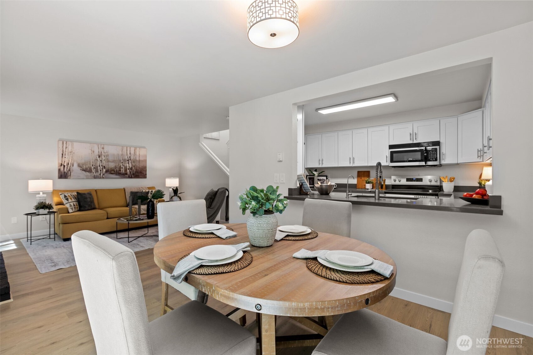 Welcome home to this beautifully refreshed 3-level townhome-style condo nestled in a small, intimate complex — where privacy, peace, and turnkey living come together. Located in the end building of the complex, you'll enjoy minimal foot traffic and a quiet, tucked-away feel, with a serene greenbelt backdrop that makes every day feel like a retreat.Step inside to discover brand new everything — fresh LVP flooring flows through the main living areas while plush new carpet adds warmth to the bedrooms. Every room has been freshly painted, and the upgraded bathrooms shine with modern finishes. The kitchen features a new range, and with a new roof and new windows throughout, the big-ticket items are already done for you.The thoughtful 3-level layout offers true flexibility. The main living area is bright and welcoming, while the lower level bonus room — with its own walkout to a fully fenced garden patio — is perfect as a guest suite, mother-in-law space, home office, or hobby room. Step outside to your private, fully fenced patio and breathe in the quiet — the greenbelt behind provides a lush, natural buffer from the rest of the world.Whether you're a first-time buyer, downsizer, or savvy investor, this move-in ready gem is the one you've been waiting for. Seller will pay the monthly HOA dues through the end of the year. Just unpack and enjoy!