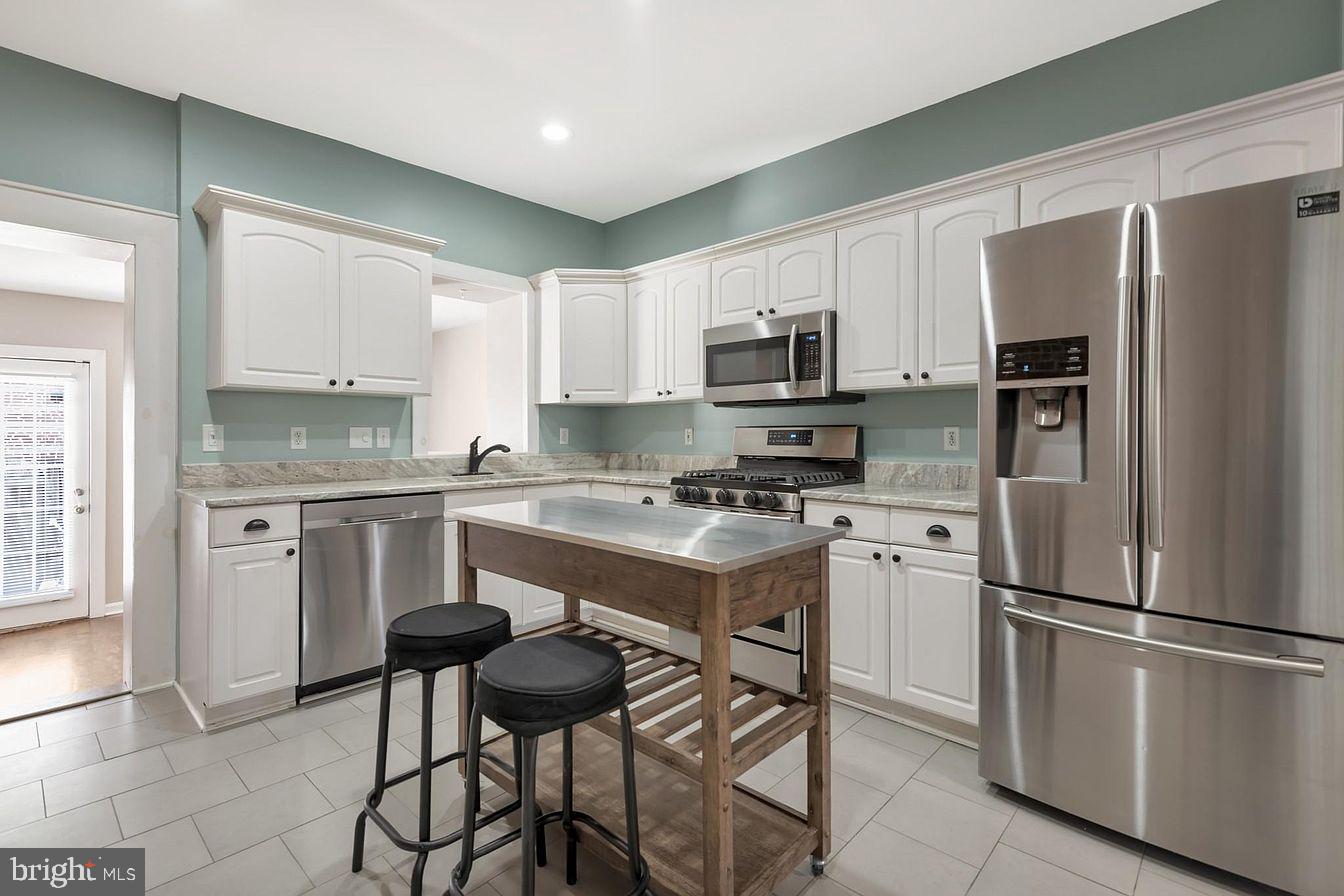 Welcome home to this beautifully updated 2-bedroom, 1.5-bath row home in the heart of Canton, just a short walk from Canton Waterfront Park and Canton Square. Blending classic Baltimore charm with modern updates, the home features original wood floors, French doors, stained glass, exposed brick, an updated kitchen with stainless steel appliances and stone countertops, and a spacious full bath with a double vanity and dual-head shower. Additional highlights include a breakfast nook or office area, large outdoor patio, and plenty of basement storage. The basement French door has been temporarily removed but can be reinstalled.Monthly rent is priced at $2,400/month; first month's rent and one month security deposit are required to move in ($4,800). Utilities are not included in the price. Verifiable income of at least 3x monthly rent and a minimum credit score of 650 are required to qualify. Pets are allowed and will be considered on a case-by-case basis.