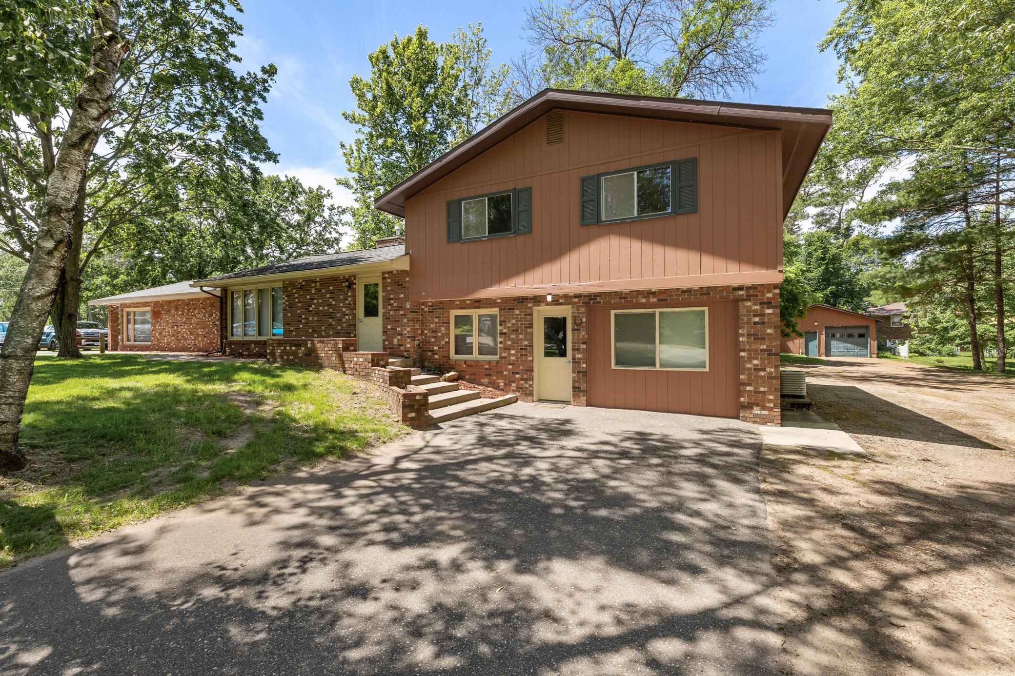 Unique opportunity to own a versatile commercial and residential property all in one! The commercial space offers 2,690 square feet and has been recently remodeled, featuring six private offices, a spacious work area, receptionist area, large conference room, two bathrooms and a kitchen area. The attached residence is a multi-level split home with over 1,800+ finished square feet offering a 4+ bedrooms and 2 bathrooms. Additional features include three central A/C units, a 24x24 two-stall garage, and a spacious paved parking lot with ample room for employees, customers, or guests. Whether you're looking to operate your business on-site, generate rental income, or expand your portfolio, this property offers endless possibilities and outstanding value. A great investment opportunity with commercial and residential flexibility!
