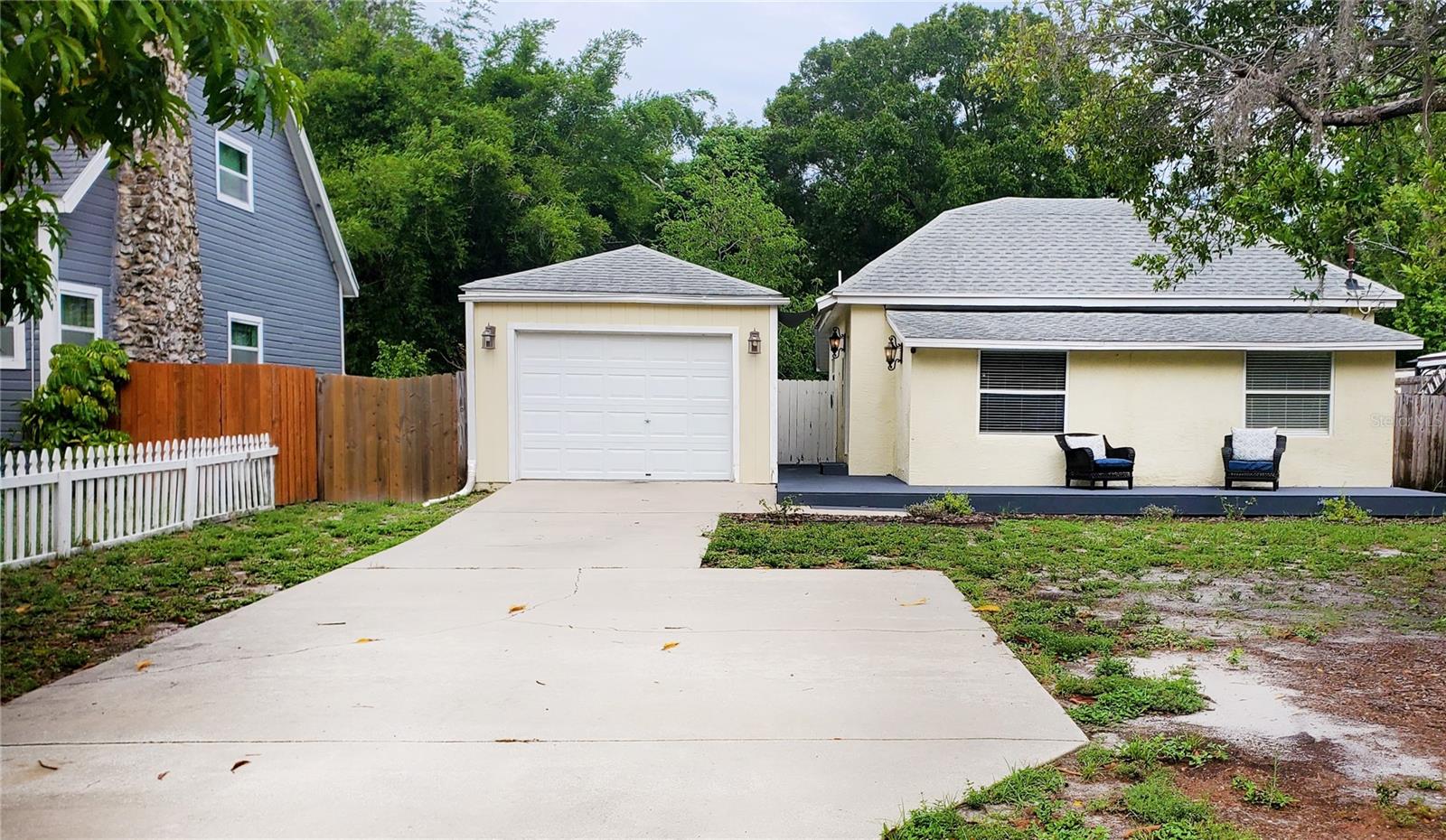 BEAUTIFULLY REMODELED 2BR, 2BA BUNGALOW in Clearwater’s desirable GULF BREEZE ESTATES. This move-in-ready, 1,097 sq. ft. home features an OPEN CONCEPT layout and a flexible BONUS ROOM, perfect for a 3rd bedroom, office, or playroom. Recent upgrades ensure peace of mind, including a 2021 HVAC, 2019 ROOF, updated PLUMBING, a new WATER HEATER & SOFTENER, Engineered HARDWOOD FLOORING throughout and new 2018 ELECTRICAL PANEL. Step outside to a private, FULLY FENCED 60x135 lot featuring a large one car detached unfinished garage, room for a pool, and brand-new FRONT & REAR DECKING. While located in a designated flood zone, this home has a sound history and has remained completely dry through recent major storms—making it a perfect, worry-free coastal retreat, minutes from world-renowned Clearwater Beach, local Dining, Shopping and major area Airports.