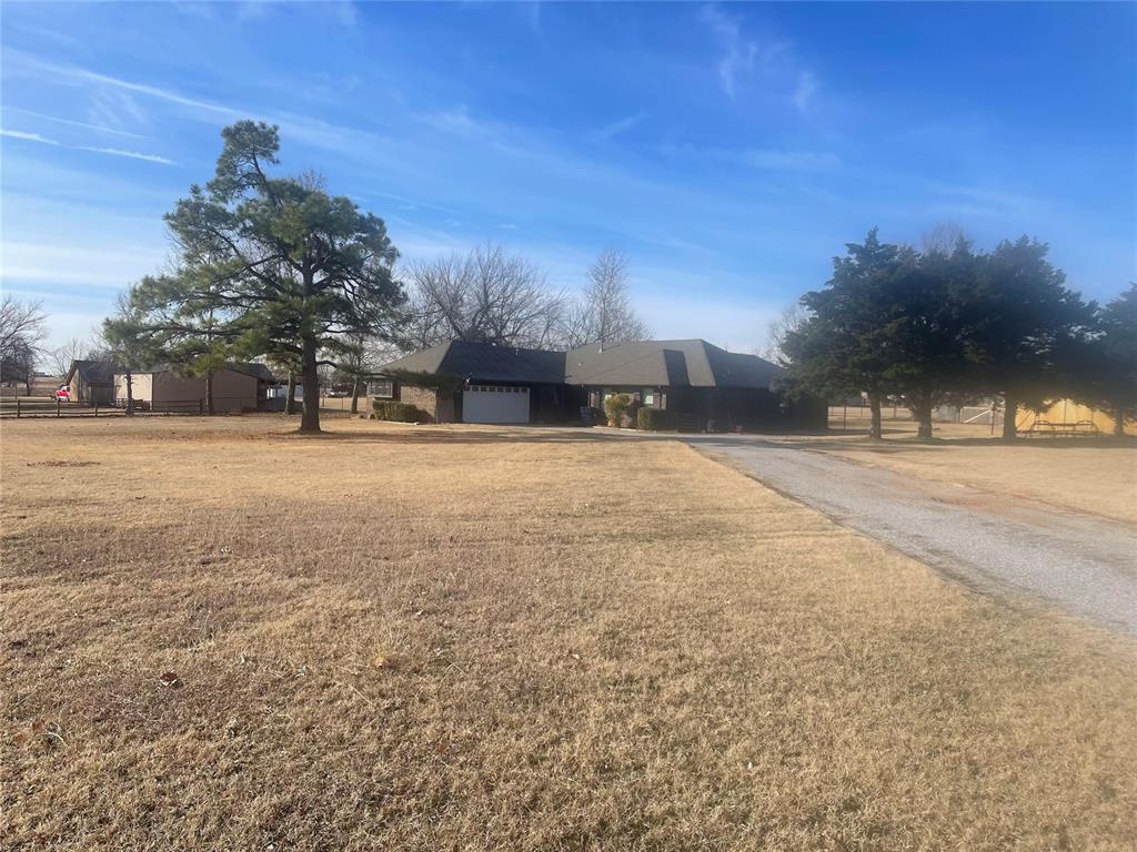 Welcome to 19201 Aerial! Wonderful home located in a desirable Edmond neighborhood with Piedmont schools! No active HOA! Situated on a 2.5 acre lot, this property offers comfortable living with thoughtful layout and ample natural light throughout. Enjoy generous living areas, functional kitchen space, and well-sized bedrooms. The outdoor area provides room to relax, entertain, or customize to your needs. Large storm shelter, aerobic septic system installed in 2017! T-3 roof installed in 2022. Some outbuildings as well! Barn has own electrical supply and concrete floor! Conveniently located near shopping, dining, schools, and major highways for an easy commute. Mls 1212094 available adjacent, 2.5 acre vacant lot! Cash or conventional only, selling as is. Needs a little cosmetic work.