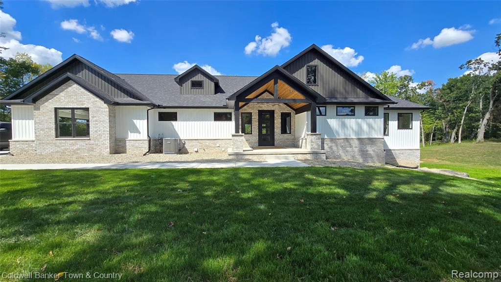 Almost Done! Now is the Time to Make It Yours!

This stunning, custom-built home is nearly complete and ready to impress, with over 540 feet of private lake frontage on scenic Lake Lochmoor. Set on nearly 2 acres at the end of a quiet cul-de-sac, it’s a peaceful escape with space for private trails and sunset views.

With 5 bedrooms and 3.5 baths, the home blends elegance and function. A covered front porch welcomes you, and the Trex deck is ideal for enjoying lake views.

Inside, the open-concept layout is filled with natural light from Andersen windows and flows into the finished walkout basement. Expansive windows wrap the lower level, showcasing the outdoors from every angle. This bright, airy space feels like a continuation of the main living area, fully connected to the lake and landscape.

The great room features vaulted ceilings with beams, a fireplace, and recessed lighting. The kitchen includes Quartz counters, a 48-inch gas stove with hood vented outside, and a grand island. The main-floor primary suite offers dual walk-in closets, double vanities, and a spa-style shower. Two additional bedrooms share a Jack and Jill bath.

Main-level features also include a mudroom, half bath, and spacious laundry room.

The walkout basement includes a rec area, game room, two bedrooms, full bath, and ample storage. A wet bar or second kitchen is roughed in—perfect for guests or an in-law suite.

The oversized 3+ car garage is fully insulated, drywalled, and includes openers. All located in a quiet, paved neighborhood just 6 minutes from I-96, with access to Ann Arbor, Lansing, and Metro Detroit.

More than a home—it’s a lakeside lifestyle crafted with light, quality, and natural beauty.

Please note: Exterior photos show the actual home. Interior photos are from past builds by the same builder with similar layouts and finishes.
