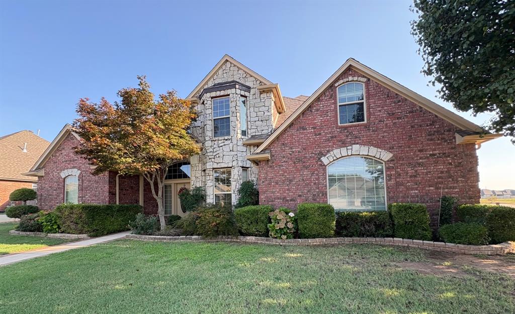 You must view this gorgeous home in desired neighborhood of Summit Lakes!  It's located on a spacious corner lot across from one of the beautiful lakes with almost 1/4 acre & walking trails all around.  There's plenty of room for outdoor activities & covered patio for entertaining & cooking out.  Kitchen has been remodeled with granite countertops and extended island.  There are so many built-in large cabinets, storage shelves and drawers throughout the home, along with very spacious rooms.  Fireplace is double sided in the living room & kitchen for added warmth in these 2 rooms.  Master bathroom has an oversized jetted tub & separate tiled shower.  Master bedroom closet is very large with lots of extra shelves for shoes or boxes. Home is so well maintained with no pets or smokers ever in the home.  Two zoned HVAC system with the one upstairs just replaced in 2024 with 10 year warranty.  Hot water heater was also new in 2024, along with the smart WiFi  garage door opener, sprinkler system & all new faucets downstairs.  Painting on the outside was done in 2023 & impact resistant shingles were installed in 2016.  Part of the extended driveway was redone in 2024.   This was a custom built home with stone castle bay windows in the front which creates a magnificent look to the home.  It's located in a great area near shopping, schools & only 2 miles to OU.  Make your appointment today!