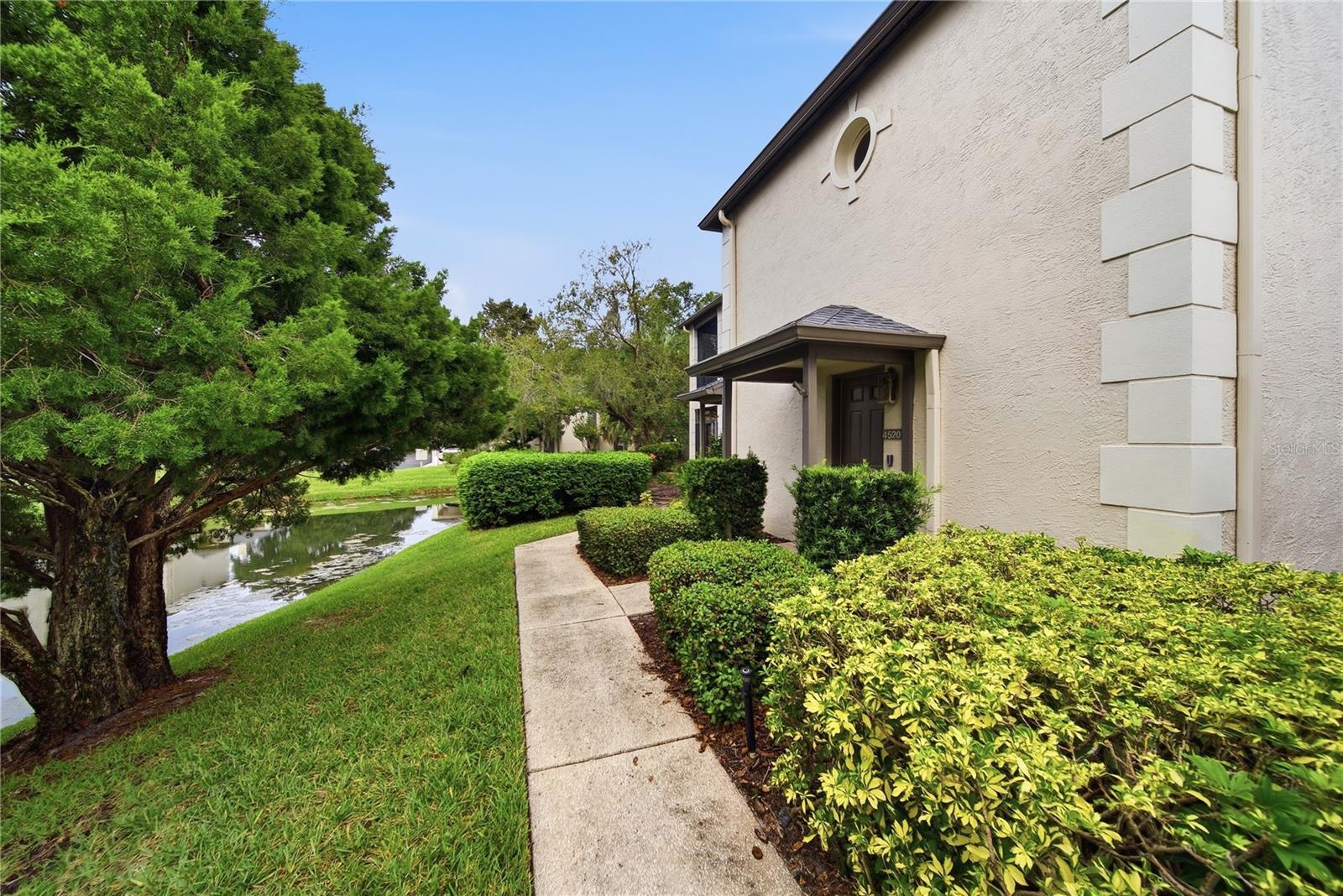 END UNIT | POND VIEW | MAJOR 2024 UPDATES | SCREENED PATIO | COVERED ASSIGNED PARKING! Welcome to Carrollwood Village Chase, a sought-after gated community where comfort, convenience, and Florida living come together. This well-maintained 2-bedroom, 1.5-bath end-unit condo offers a spacious 1,354 sq. ft. layout, fresh interior paint, professionally cleaned carpeting, and a cozy wood-burning fireplace.The large screened-in patio overlooking a peaceful pond provides a wonderful outdoor retreat for morning coffee, relaxing, or entertaining. The end-unit location offers added privacy and natural light, while the covered assigned parking space adds everyday convenience.Numerous updates provide peace of mind, including all hurricane-impact windows and the sliding glass door replaced in 2024, roof replaced in 2023, and exterior paint completed in 2023. Additional improvements include an approximately 5-year-old A/C system, 6-year-old tankless water heater, washer approximately 5 years old, and dryer replaced just last month.Enjoy the amenities of Carrollwood Village Chase, including a community pool, spa, and clubhouse. Ideally located across from the Carrollwood Cultural Center and close to shopping, dining, major roadways, Downtown Tampa, Tampa International Airport, and Tampa Bay's beautiful beaches. A fantastic opportunity to enjoy a low-maintenance Florida lifestyle in a desirable Carrollwood location!