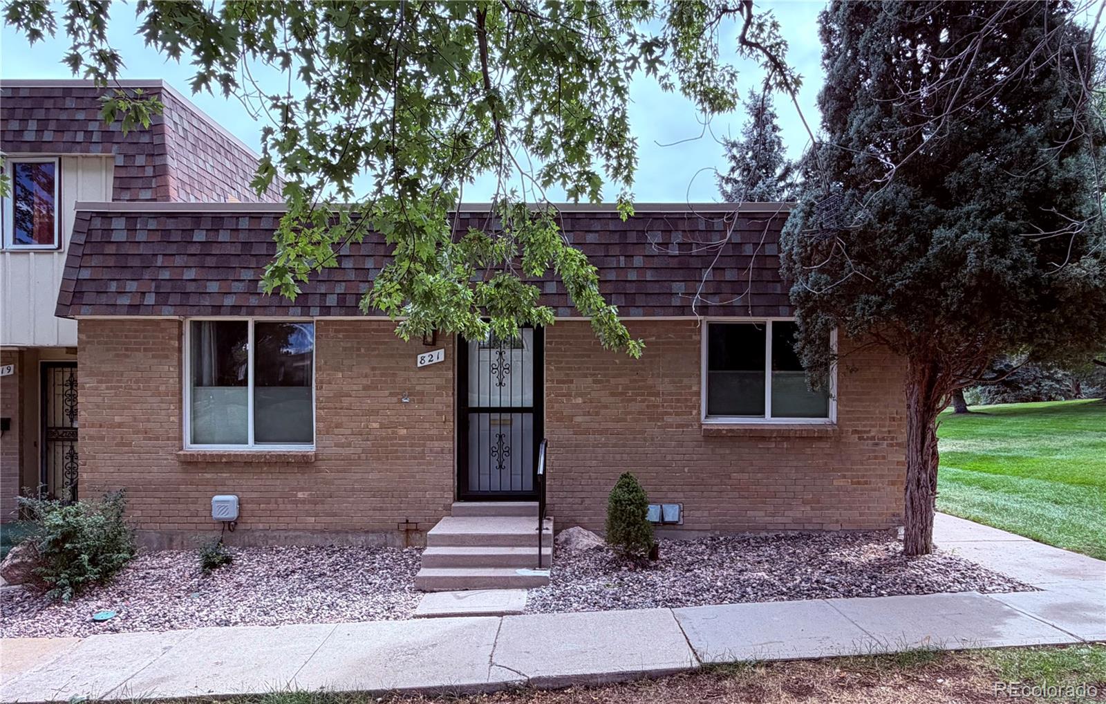 Welcome to your future home! This beautiful 3-bedroom, 2-bathroom townhome has the perfect layout for any lifestyle! A ranch style home is a rare find in this community and located in the highly desired Green Mountain area. Not only does this main level provide the convenience of one-level living, it's primary bedroom has it's own full private bathroom. Not getting your laundry done is no excuse here, as the laundry area is just a few steps away from each bedroom. Need to unwind after a day of nonsense? Well, you can do so on your own private patio. Want to sit down and enjoy your morning coffee? Well that nice patio is also fenced, so you can enjoy the sunrise in peace on that patio too. Enjoy the peaceful evenings this community provides before going out into the world again. If you've had enough of the summer heat and already dreading next summer, don't worry, the A/C was replaced September of 2026! Popcorn belongs to movie night, not the ceilings. It's been removed, so no popcorn ceilings here! The wood floors look great and the windows have been updated. The previous owners added wall insulation too. They kept up on annual furnace maintenance (which will be helpful if winter decides to ever get cold again). With neighboring trails, restaurants, and a quick drive to all major highways this townhome will give you access to go anywhere your heart desires. Unless you take the long way with any of these: Red Rocks Amphitheater, Golden, Downtown Denver, and the Broncos Stadium are all around 10 miles away. Belmar is under 4 miles away. St Anthony hospital is around 2 miles away, if you don't like that hospital, Intermountain Health Lutheran Hospital is around 6 miles away. The Colorado Mills is under 5 miles away. But the community pool house wins the race as it is only a small walk from the front door! You can book your private parties and celebrate all the birthdays whenever, it is opened year round.
