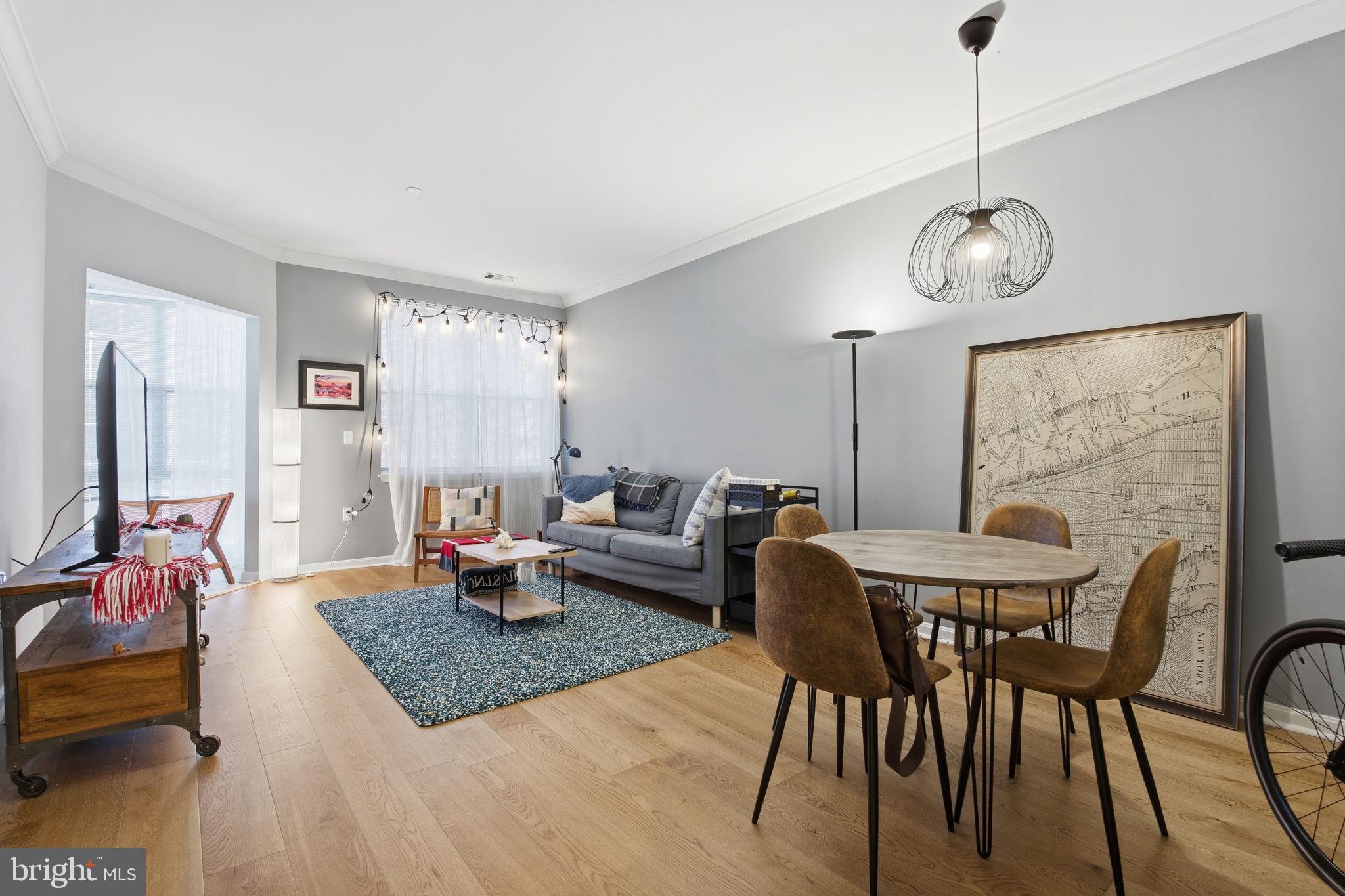 A city dweller's and water lover’s dream location in Pierside at Harborview, an amenity-rich condominium where you will find the finest in convenience and location. Welcome to this spacious one bedroom, one bath unit with a sunroom making this unit up to 810 sq ft of space! This property offers a fantastic layout, wonderful natural light, and the convenience of this full-service building. Relax in the sun-drenched living room / dining room with its crown molding and warm wood flooring. Enjoy the versatile sunroom / office with walls of windows. The crisp kitchen has granite counters, great prep space, and a breakfast bar; the kitchen opens to the living room and dining room. The generous primary bedroom offers ample closet space and continued wood floor throughout. The unit is complete with a ceramic tile bathroom and in unit stackable washer and dryer. This pet-friendly complex has tons of amenities including 24-hour concierge, a picturesque courtyard, a gorgeous pool with grills, a fitness center, and secure parking. The building is conveniently located with easy access to I-95 and I-83 with plenty of trendy bars, restaurants, and activities close by.