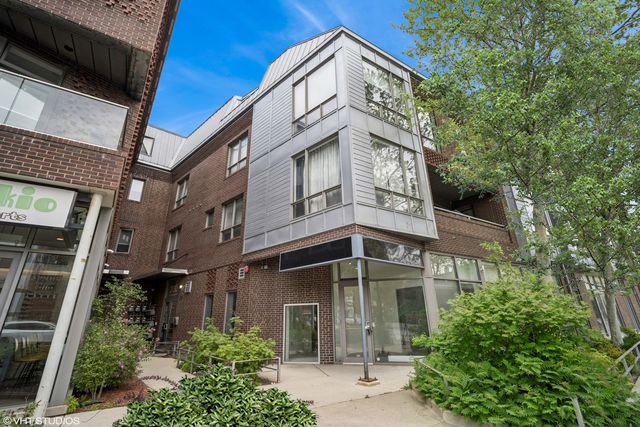 Welcome home to this stunning 2-bedroom, 2-bathroom + den duplex-up condo in a boutique elevator building in the heart of Wicker Park! Inside you're greeted by sun drenched, south facing windows overlooking the treetops, filling the home with natural light. The open-concept living area features soaring ceilings and hardwood floors throughout, seamlessly connected to the well-appointed kitchen. Boasting granite countertops, Bosch stainless steel appliances, a wine fridge, and 42" cabinetry, perfect for both everyday living and entertaining. The main level includes a full bathroom and a versatile second bedroom complete with a built-in Murphy bed and an expansive closet. Upstairs, the den makes the ideal home office or Peloton room with access to your private 10' x 18' deck, perfect for lounging and taking in skyline views. The massive primary suite is a true retreat, offering a separate lounge space, large windows, an organized walk-in closet, and a spa-like bath with dual vanities, an air-jet soaking tub, and a separate rain shower with body sprays. Additional highlights include 8-foot solid doors, heated attached garage parking, and ample storage. Set in a boutique, heavily owner-occupied building with low assessments, this home offers the best of city living with all of Wicker Park right outside your door. Just moments from the Six Corners, the Damen Blue Line, Milwaukee and Damen Avenue shops, nightlife, restaurants, the 606 Trail and quick access to downtown and expressways.