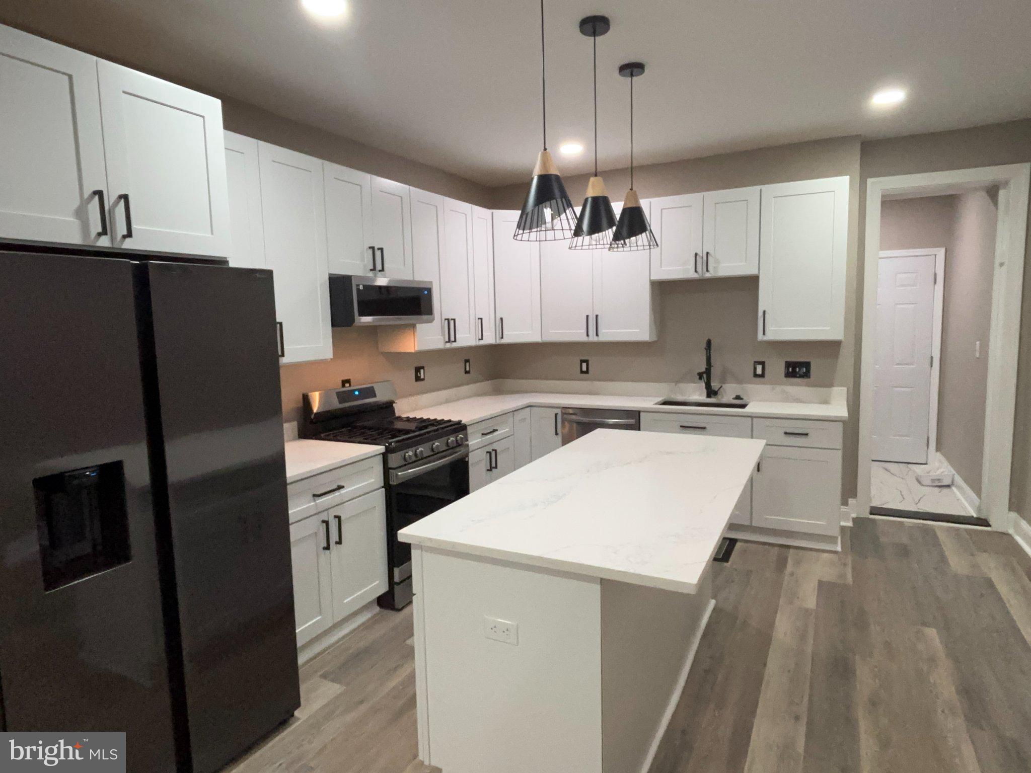 Nestled in the charming North Harford Road neighborhood, this exquisite interior row townhouse offers a perfect blend of classic elegance and modern convenience. Built in 1930 and just majorly renovated in 2026, this home is poised to deliver an unparalleled living experience, showcasing high-end finishes and thoughtful design throughout. Step inside to discover a warm and inviting atmosphere, accentuated by a combination kitchen and living area that seamlessly integrates space for both relaxation and entertaining. The kitchen is equipped with top-of-the-line appliances, including a built-in microwave, range, and dishwasher, ensuring that culinary enthusiasts will feel right at home. The single oven and refrigerator provide ample functionality, while the stacked washer and dryer on the upper floor add convenience to your daily routine. The interior features a luxurious walk-in shower in the full bathrooms, offering a spa-like retreat for unwinding after a long day. Plush carpeting throughout enhances the comfort of the living spaces, creating a cozy ambiance that invites you to settle in and make this house your home. With two spacious bedrooms, this residence provides ample room for personalization, whether you envision a serene master suite or a stylish guest room. The double-hung windows and two skylights on the second floor allow natural light to flood the interiors, creating a bright and airy environment that uplifts the spirit. The property sits on a level lot of 0.02 acres, providing a manageable outdoor space that complements the urban lifestyle. Parking is a breeze with a concrete driveway and additional on-street options available, ensuring that you and your guests will always have a place to park. Located in an urban setting, this home is conveniently situated near public transportation options, including bus stops and commuter rail stations within a mile, making commuting effortless. Immerse yourself in the local culture. Available for lease starting September 10, 2026, with a minimum lease term of 12 months, this property also offers the option for purchase, providing flexibility for your future plans. Rent includes essential services such as HVAC maintenance, parking, and trash removal, allowing you to enjoy a hassle-free lifestyle. Experience the exclusive lifestyle this remarkable townhouse has to offer, where luxury meets comfort in a prime urban location. Don't miss the opportunity to make this stunning property your own.