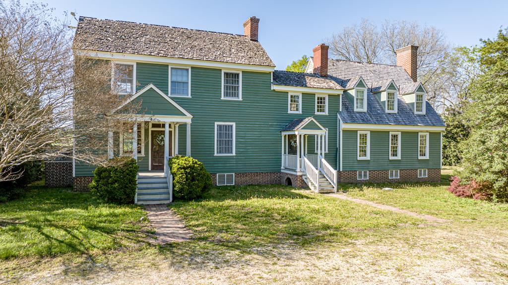 Step back in time with all the space you need to grow. This charming farmhouse-style home sits on 4.21 acres and features 4 bedrooms, 2.5 baths, and 3,903 sq ft of timeless character. Nearly every room includes a fireplace, adding cozy charm throughout. Unique features include two separate basements, a large attic, a bright sunroom, and spacious bedrooms with large closets. Outside, enjoy a paddock, chicken coop, pavilion, and 2.5 acres of fenced pasture—perfect for horses, cows, or alpacas. The side yard is filled with beautifully diverse garden beds, ready for your green thumb. Nestled in the peaceful countryside yet close to Exmore, Cape Charles, beaches, wineries, and the Chesapeake Bay, this home blends privacy, convenience, and endless possibilities.