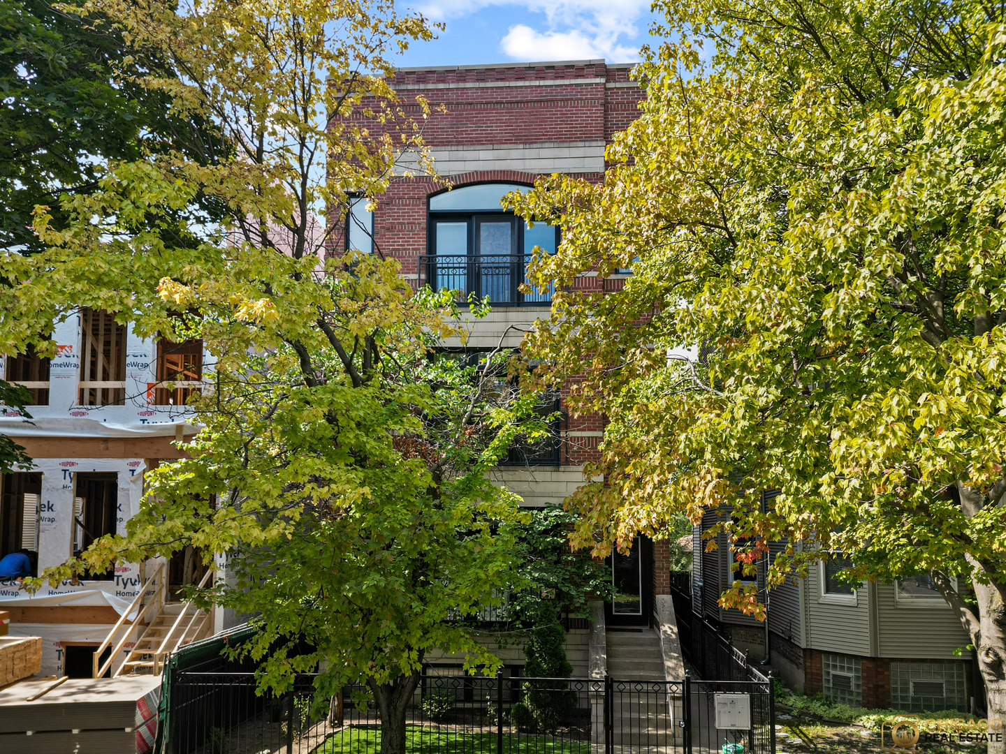 Welcome to a home that's more than just a condo - it's a lifestyle. Nestled on a quiet stretch of Damen in North Center, this extra-wide 2 bed, 2 bath residence offers the perfect blend of comfort, character, and convenience. Hardwood floors and sunlight set the stage, while the wide living room with cozy fireplace and elegant wainscoting creates a warm space to gather. The chef's kitchen, complete with Viking appliances, quartz countertops, a large island with built-in microwave, and designer finishes, is ideal for hosting dinner parties or casual brunches.  The oversized primary suite is your retreat after a busy day, featuring a spa-like bath with steam shower and heated floors. A second bedroom with a walk-in closet provides flexibility for guests or family, and a smartly placed nook off the living room makes working from home seamless.  Summer nights come alive on the extra-large back deck with direct primary bedroom AND hallway access - perfect for grilling, entertaining friends, or unwinding under the stars.  With recent updates like a new furnace (2022), A/C (2023), washer/dryer (2023), Nest thermostat, and a newly replaced roof (2022) on an all-around masonry brick building, you'll enjoy peace of mind as much as you do the design.  Life here is effortless with indoor garage parking, large private basement storage, and low assessments in a pet-friendly, well-kept 3-unit building.  Step outside and you're moments from Roscoe Village dining, Southport shopping, Wrigley excitement, and some of the city's best parks. Walk to Bell Elementary -  one of Chicago's top-rated schools -  hop on the Brown Line, or grab coffee from local favorites like The Bakehouse or Ritual, or enjoy dinner at neighborhood gems like Le Sud, Frasca Pizzeria, or Basant - everything you need is just steps away.  Designed for the way you want to live,  in an unbeatable location - a  rare find on the market right now - and it won't last long!