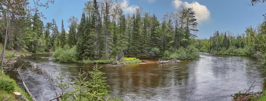 Recently ranked the #1 fly-fishing destination in America by USA Today, the majestic Au Sable River is as pristine as it is picturesque. This rare, estate-sized 20 acre parcel features over 1,500 feet of frontage and spans both sides of the iconic DevilÃ¢â‚¬â„¢s ElbowÃ¢â‚¬"guaranteeing million-dollar views for eternity. The existing home sits high above the river with unobstructed long views both up and downstream of this legendary bendÃ¢â‚¬"one of the most scenic and storied stretches on the entire river. With approximately 1 acre of land across the river, fully surrounded by 30,000 acres of protected State Forest, the property offers unmatched privacy and unique opportunities for adventure and exploration. The setting is park-like and peacefulÃ¢â‚¬"just the sound of birdsong and the flowing river. Whether you restore the existing cabin or build new, this is the ultimate retreat property. Bring your fly rod, your kayaks, and your vision. Trophy parcels like this donÃ¢â‚¬â„¢t come around twice.