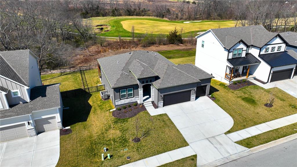 Welcome to 1024 Branchwood Lane in Raymore, a newly constructed home offering a clean, modern feel with thoughtful design and room to grow. This 2-bedroom, 2-bath layout is ideal for those seeking main-level living without giving up future potential.The primary suite stands out with a custom-designed closet that adds both style and everyday functionality. The second bedroom and full bath provide flexibility for guests, a home office, or additional living needs.One of the most valuable features of this home is the unfinished walkout basement. With space to accommodate two additional bedrooms and another full bathroom, it gives you the opportunity to expand your living space over time while adding long-term value.Step outside to a fenced backyard that backs directly to the Creekmoor Golf Course, offering peaceful fairway views and a setting that feels both open and private. Whether you are enjoying a quiet morning or winding down in the evening, the backdrop is hard to beat.This is a rare opportunity to own new construction in a golf course community with the flexibility to grow into the home as your needs change.