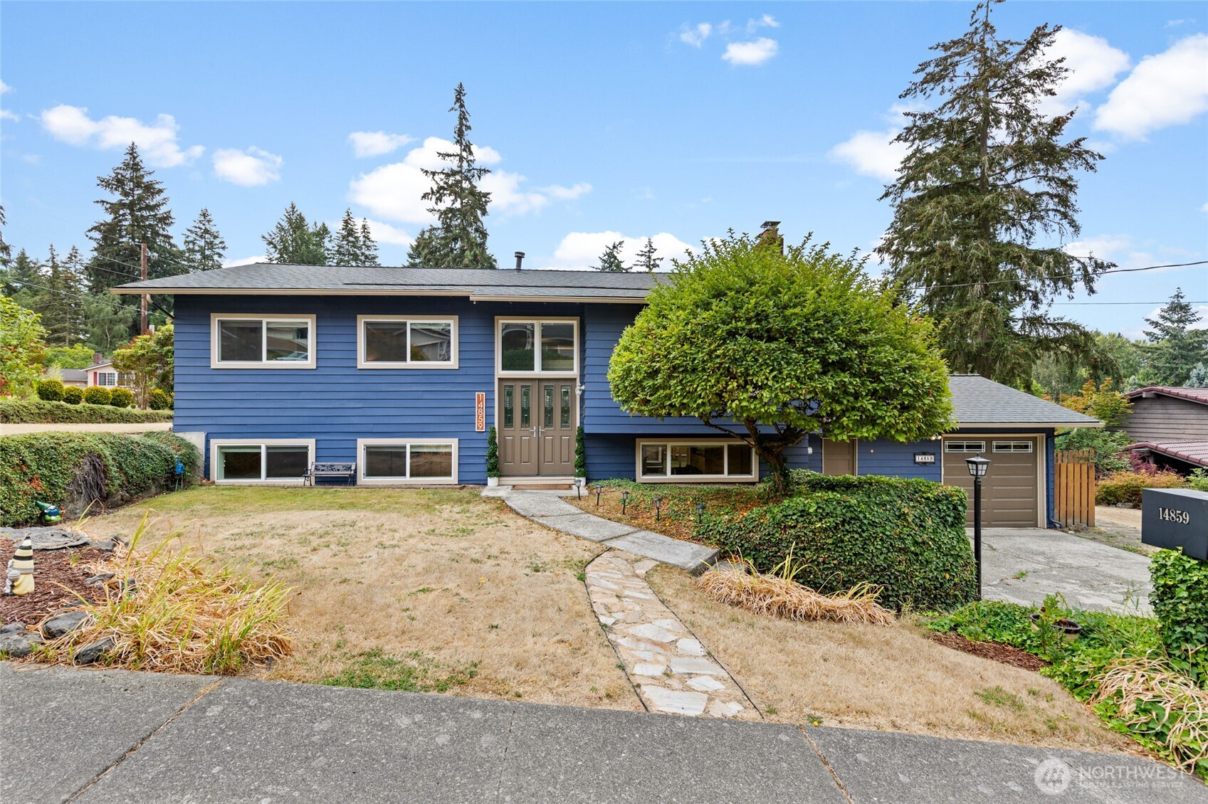 Welcome to this beautifully updated 5-bedroom, 2.75-bath home nestled on an expansive level corner lot at the end of a quiet cul-de-sac in one of Bellevue’s most sought-after neighborhoods. Offering a perfect blend of comfort and style, this move-in-ready home features spacious living areas ideal for gathering, entertaining, or working from home. Enjoy peace of mind and year-round comfort with a 2024 roof  and a 2017 heat pump system with a high-quality air scrubber. The interior boasts a newer kitchen remodel featuring granite countertops, natural maple cabinets, and an undermount sink, alongside recent bathroom remodels with cultured marble solid surface walls, quartz countertops, and updated plumbing. The home offers easy-maintenance living with hardwood flooring on the second floor, LVP in the basement, and double-pane windows all around. The recently resealed deck overlooks a fully fenced backyard with a quaint shed offering additional storage, including a spacious loft. The attached garage offers workshop or gym potential and includes a large driveway, providing ample parking for guests, recreational vehicles, or multiple drivers. Ideally located just minutes from Microsoft, Crossroads Bellevue, Bellevue Square, and major highways like SR-520 and I-405, this home also provides exclusive access to a private neighborhood park. With top-rated Bellevue schools this is a rare opportunity to own a beautifully maintained home in the heart of Bellevue.