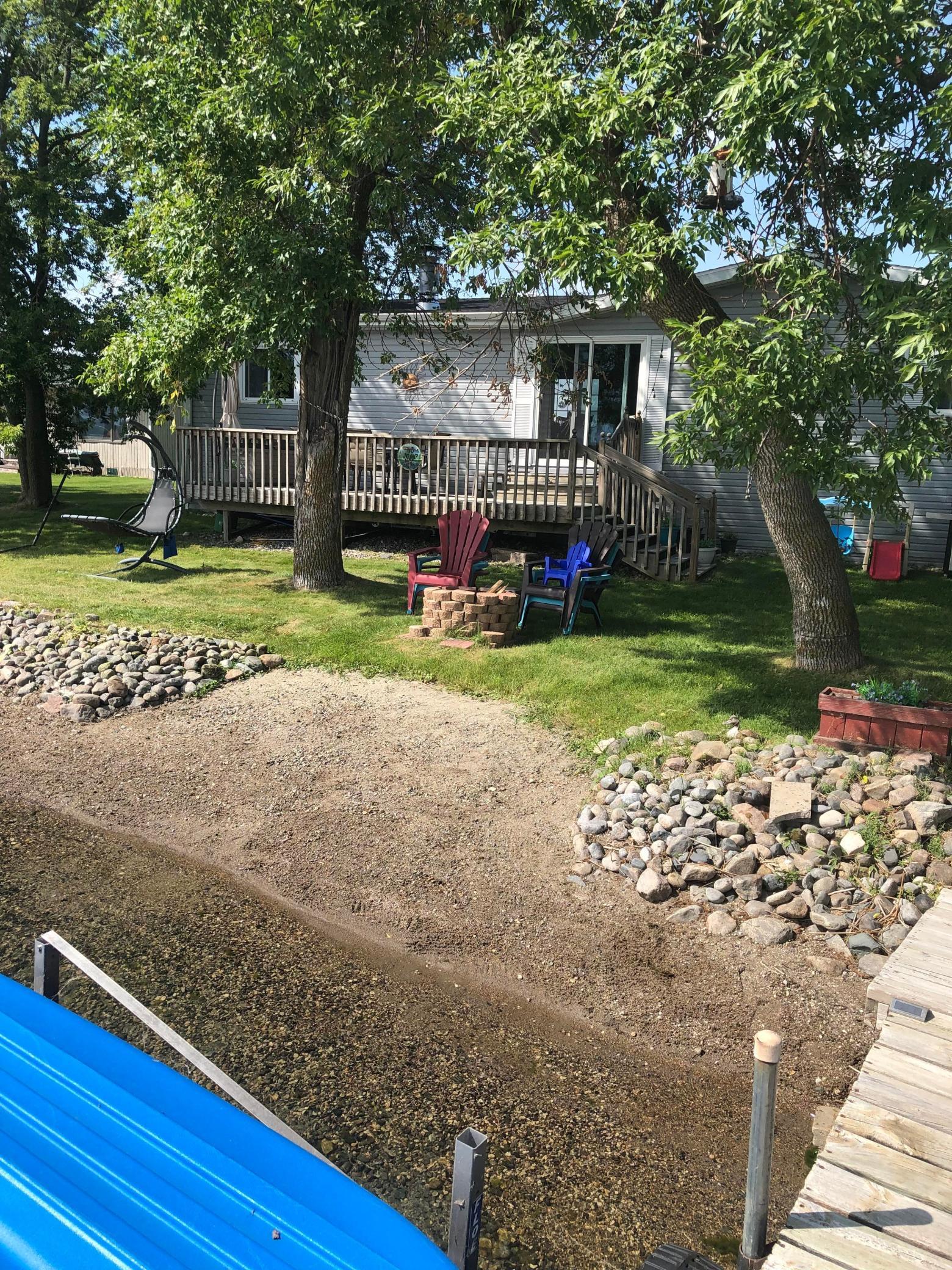 LAKE LIDA!  SELLERS  ARE MOTIVATED and are now including their 2015 Sylvan pontoon with the sale! This move-in ready home comes fully furnished and includes the dock so you can just move in and be on the lake by Spring!  Property features 3 bedrooms (a spacious master), 2 remodeled bathrooms (one being a master), wood burning fireplace, living room with patio door to lakeside deck, dining room with patio door to back yard deck, propane forced air furnace, central air, and double detached garage with separate storage area.  Updates include new shingles, new vinyl siding (including plywood and Tyvek under siding), remodeled bathrooms with tiled showers, new vanities and toilets, painting throughout home, new fireplace mantel and stone surround, appliances, patio door, landscaping, and double garage door (see Home Improvements list for more detail).  This lot is level to the lake with 70’ of sandy lake frontage, and has great fishing, swimming, boating and recreation.