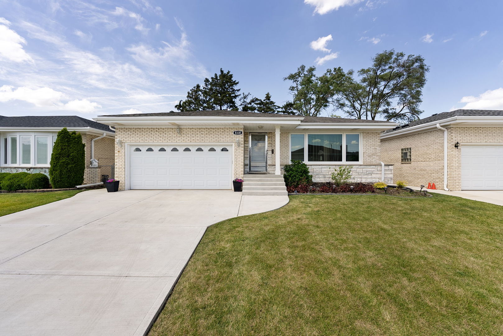 WOW!!! Welcome to this oversized custom-built brick ranch on the market for the first time! This spacious home features a thoughtfully designed layout and many improvements, making it move-in ready for its next owner. Home features large living room and formal dining room. Large eat-in kitchen that accommodates a large kitchen table that has tons of cabinets and counter space! Brand New LG refrigerator was purchased in March. Other LG appliances in kitchen are newer (2021). 1st floor features rare 2 full bathrooms that have been totally remodeled (2018) with marble top and flooring tile wall time!  No expenses were spared.  3 large bedrooms with generously large closets. Main bedroom has 2 large closets, as well. The first floor has hardwood floors throughout. Walk down fully finished basement that features grand wood burning fireplace! The entire basement is tiled and features a full summer kitchen, a storage room, and tons of storage closet space. Laundry room has new GE washer and dryer!! Large, attached garage and attic storage. Home has many updates. Newer roof, concrete driveway walkways and front porch! All appliances have been updated. Furnace and AC also newer (2024). This home is a must see to appreciate. You will not be disappointed!!