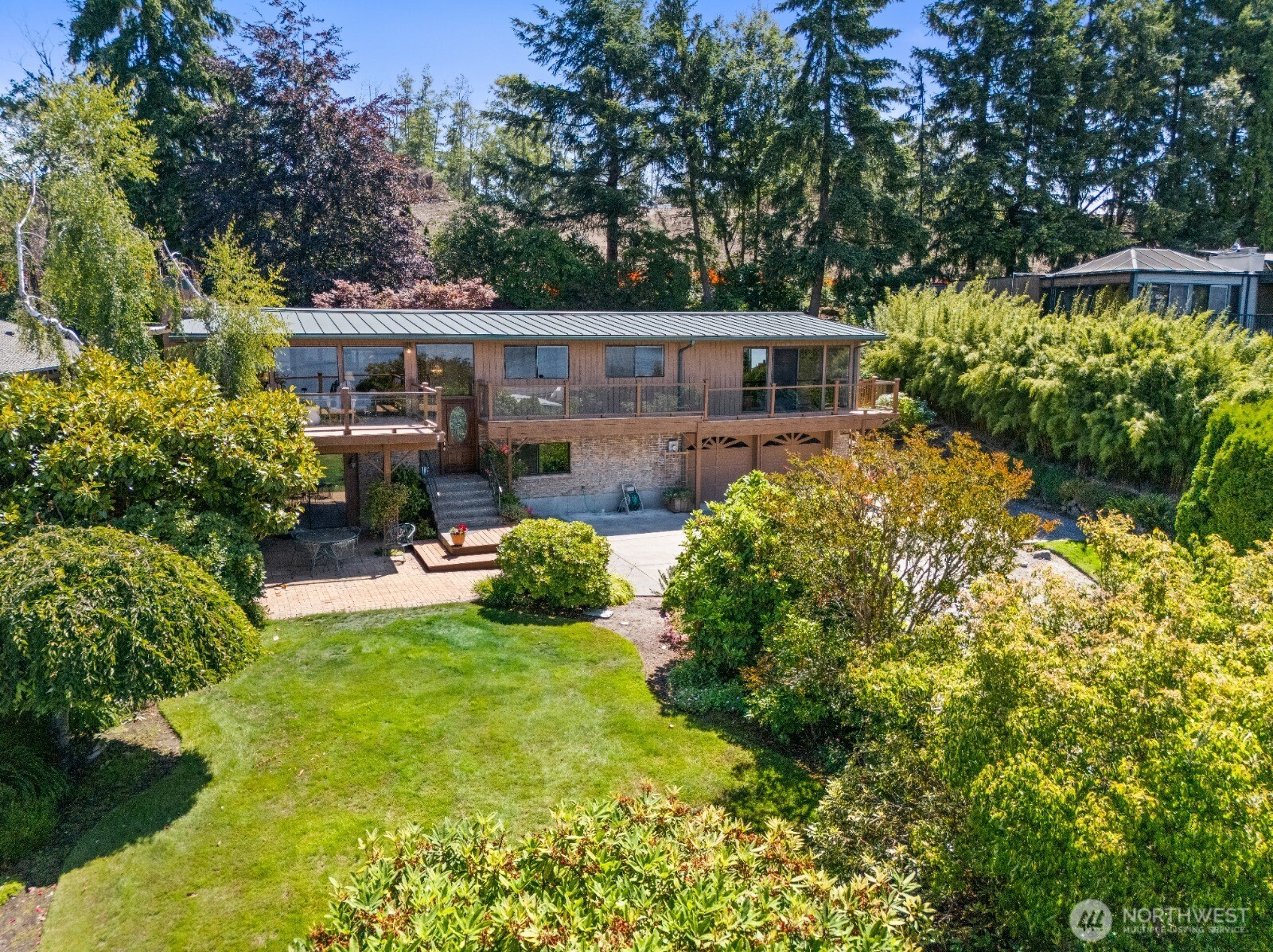 Nestled along coveted Browns Point Scenic Drive, this exceptional view home captures breathtaking panoramic vistas of Puget Sound, the Olympic Mountains, and unforgettable Northwest sunsets. Designed for both everyday living and memorable entertaining, this spacious home offers room to spread out with multiple living areas, a fully finished basement, and a beautifully landscaped 1/3-acre lot surrounded by mature plantings. Expansive windows frame the ever-changing water views, filling the home with natural light and creating a peaceful connection to the outdoors. Stay comfortable year-round with A/C, and enjoy the freedom of no HOA. Located in one of Tacoma's most desirable waterfront communities, you'll appreciate the quiet neighborhood atmosphere with convenient access to Browns Point Lighthouse, Dash Point State Park, scenic walking trails, local parks, beaches, and endless shoreline recreation. Whether you're enjoying your morning coffee overlooking the Sound or gathering with friends as the sun sets behind the Olympics, this is more than a home...it's a front-row seat to the beauty of the Pacific Northwest.